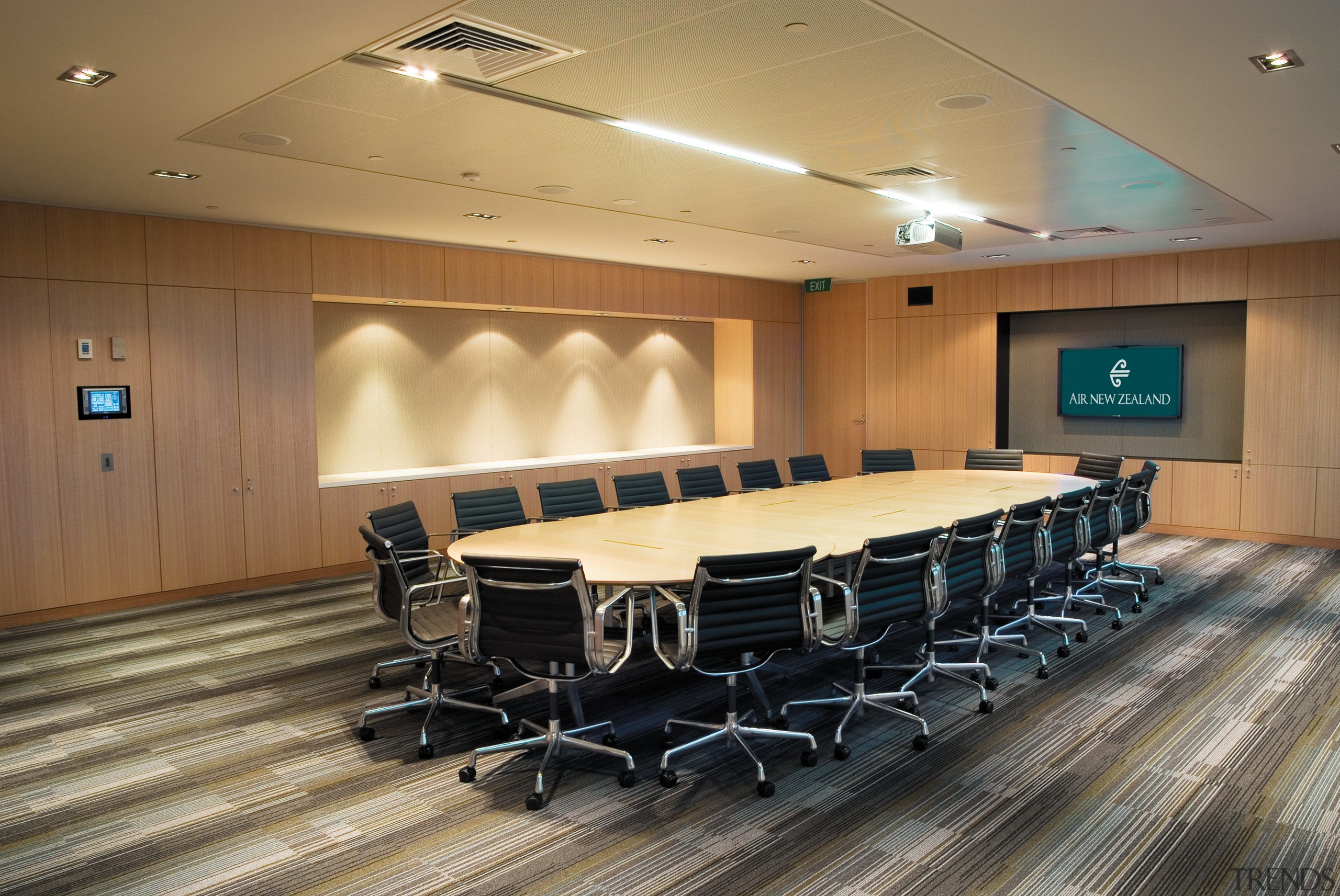 A view of the AirNZ building. - A auditorium, ceiling, conference hall, convention center, floor, flooring, function hall, interior design, table, brown