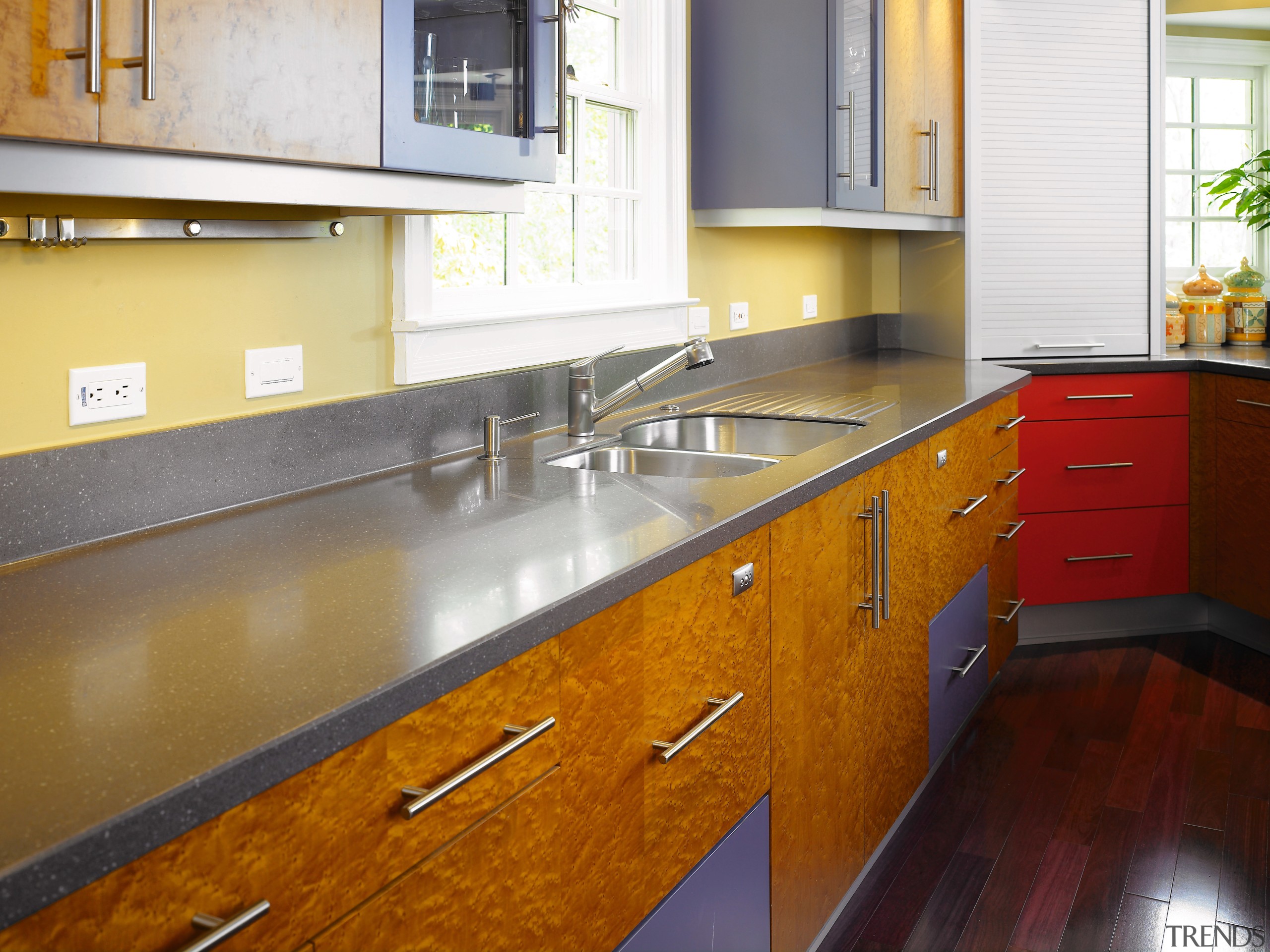 A view of this kitchen featuring the Corian cabinetry, countertop, floor, flooring, hardwood, interior design, kitchen, real estate, room, wood flooring, brown