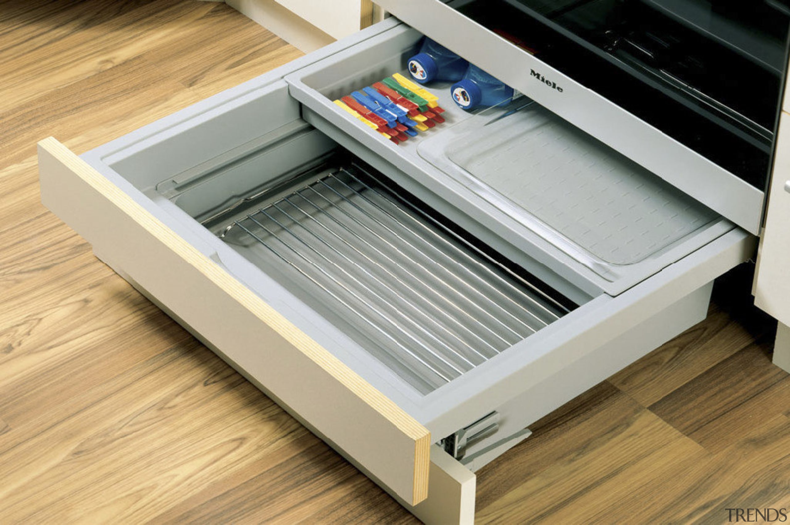 View of kitchen cabinetry with Hettich hardware and drawer, furniture, product, product design, orange, gray