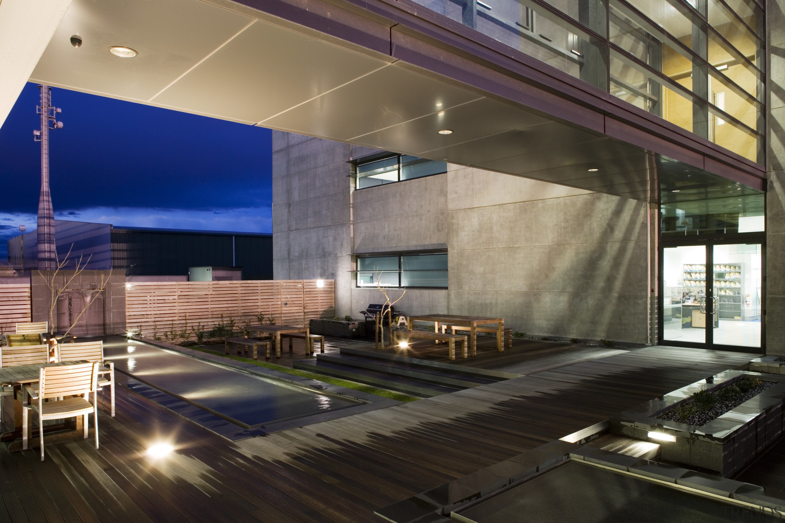 A communal cafe on the ground floor encourages apartment, architecture, condominium, daylighting, interior design, lobby, real estate, black