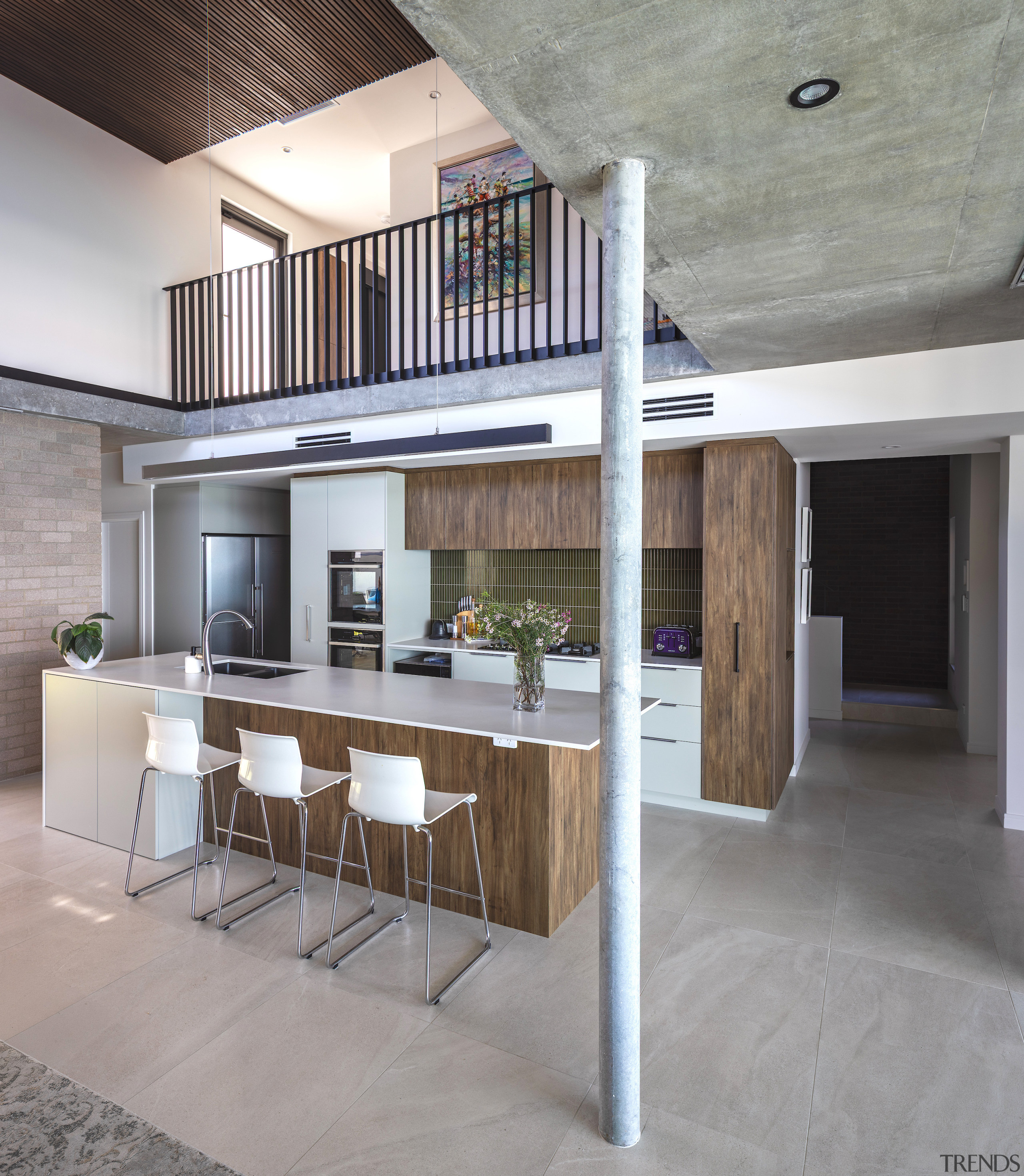 Kitchen with upstairs circulation above. - Sculpted by 