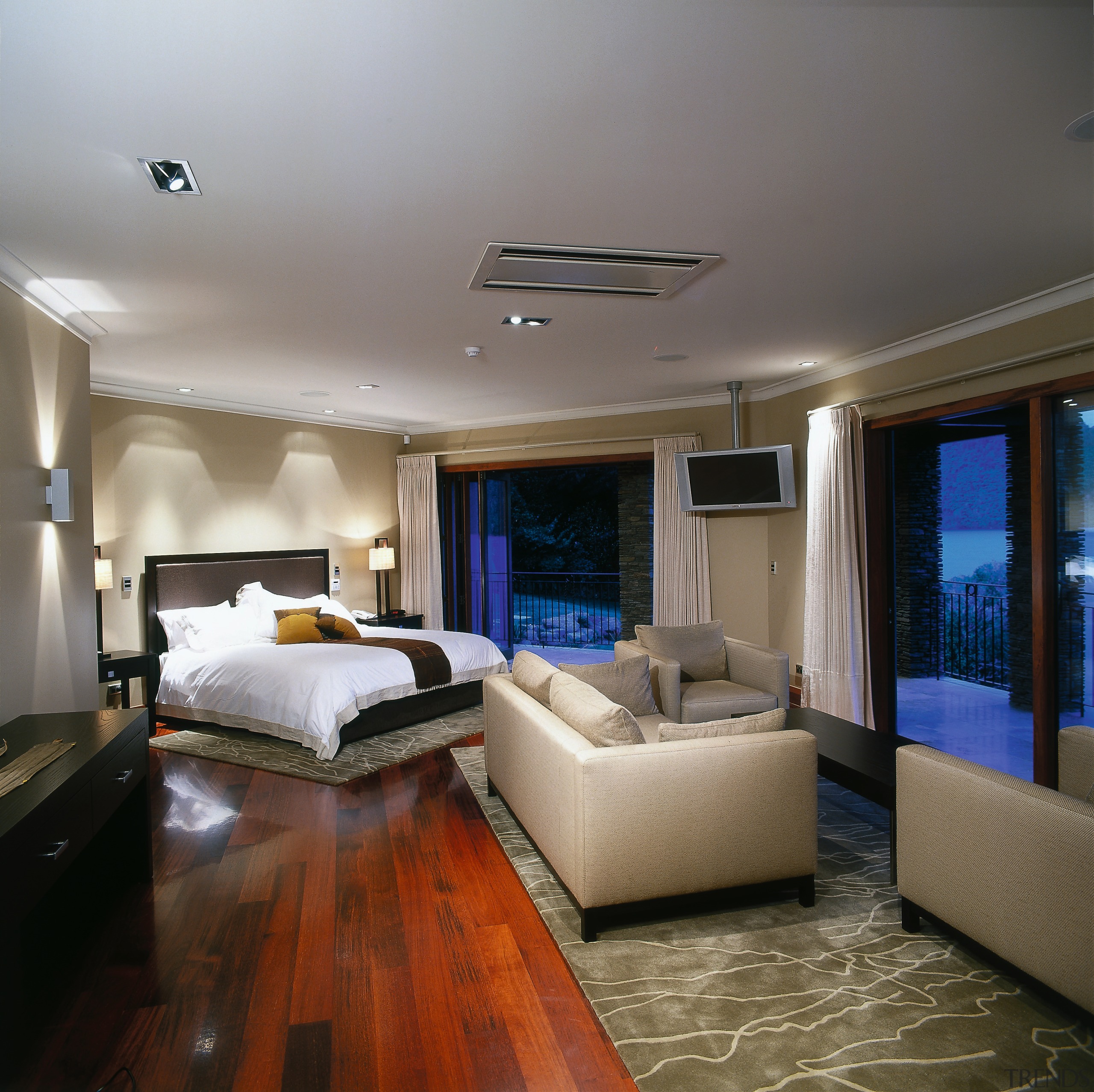 Broad view of the master bedroom. This bedroom ceiling, floor, interior design, living room, real estate, room, suite, gray, brown