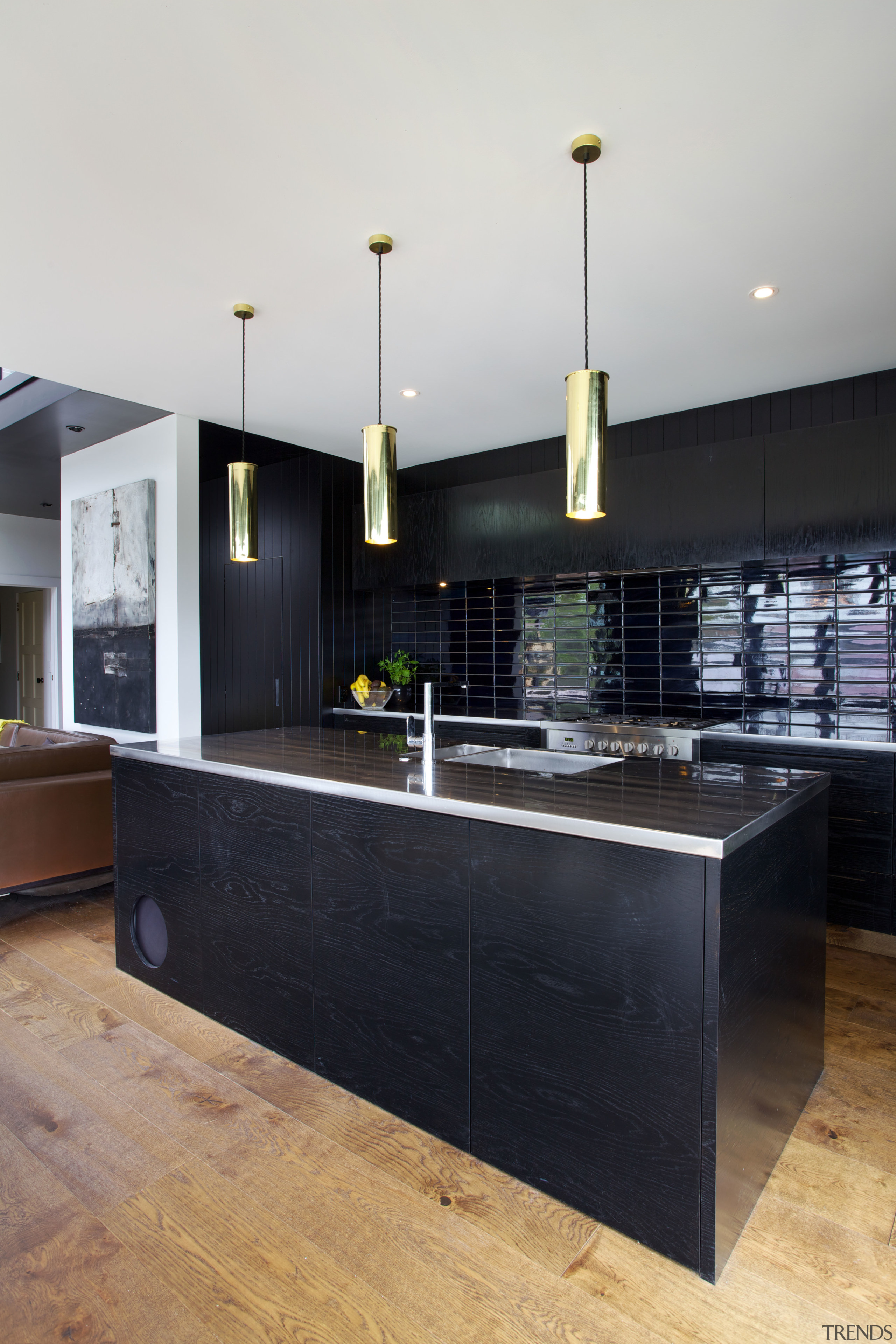 In this black kitchen there are three brass architecture, countertop, interior design, kitchen, black, white