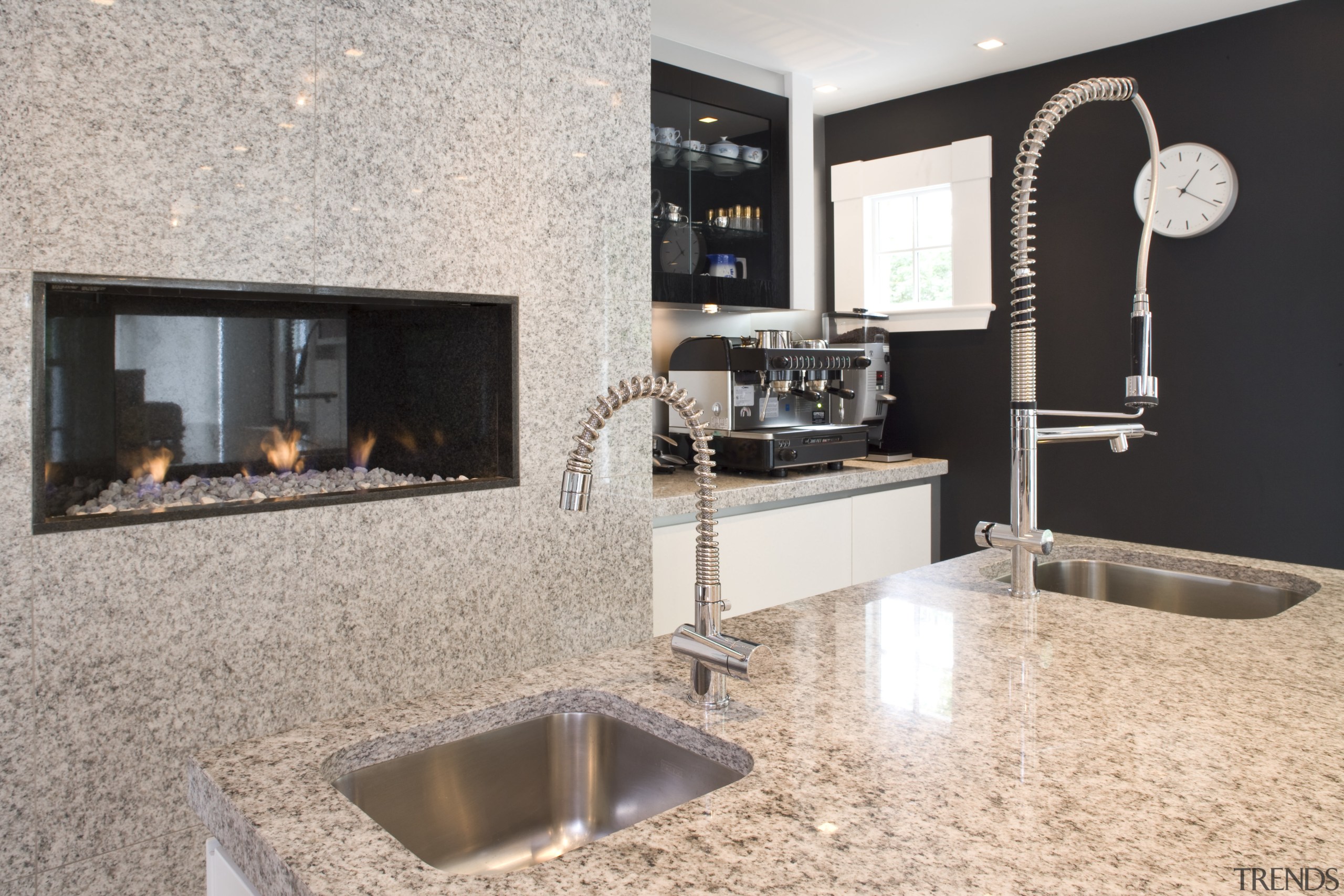 Kitchen has Granite tops and contrasting dark walnut countertop, floor, flooring, interior design, kitchen, gray