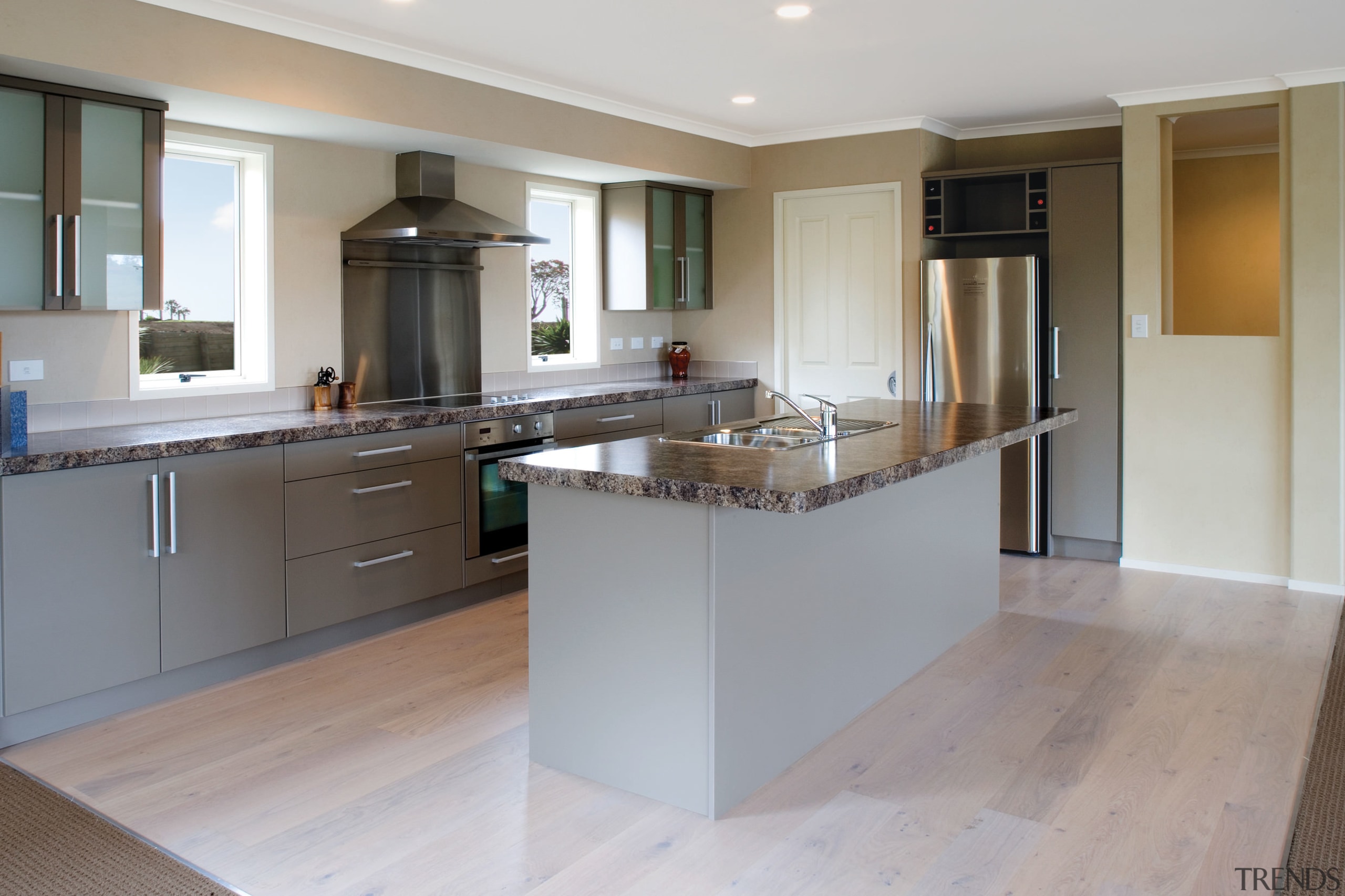 view of the kitchen in a house built cabinetry, countertop, cuisine classique, floor, flooring, hardwood, interior design, kitchen, property, real estate, room, wood flooring, gray