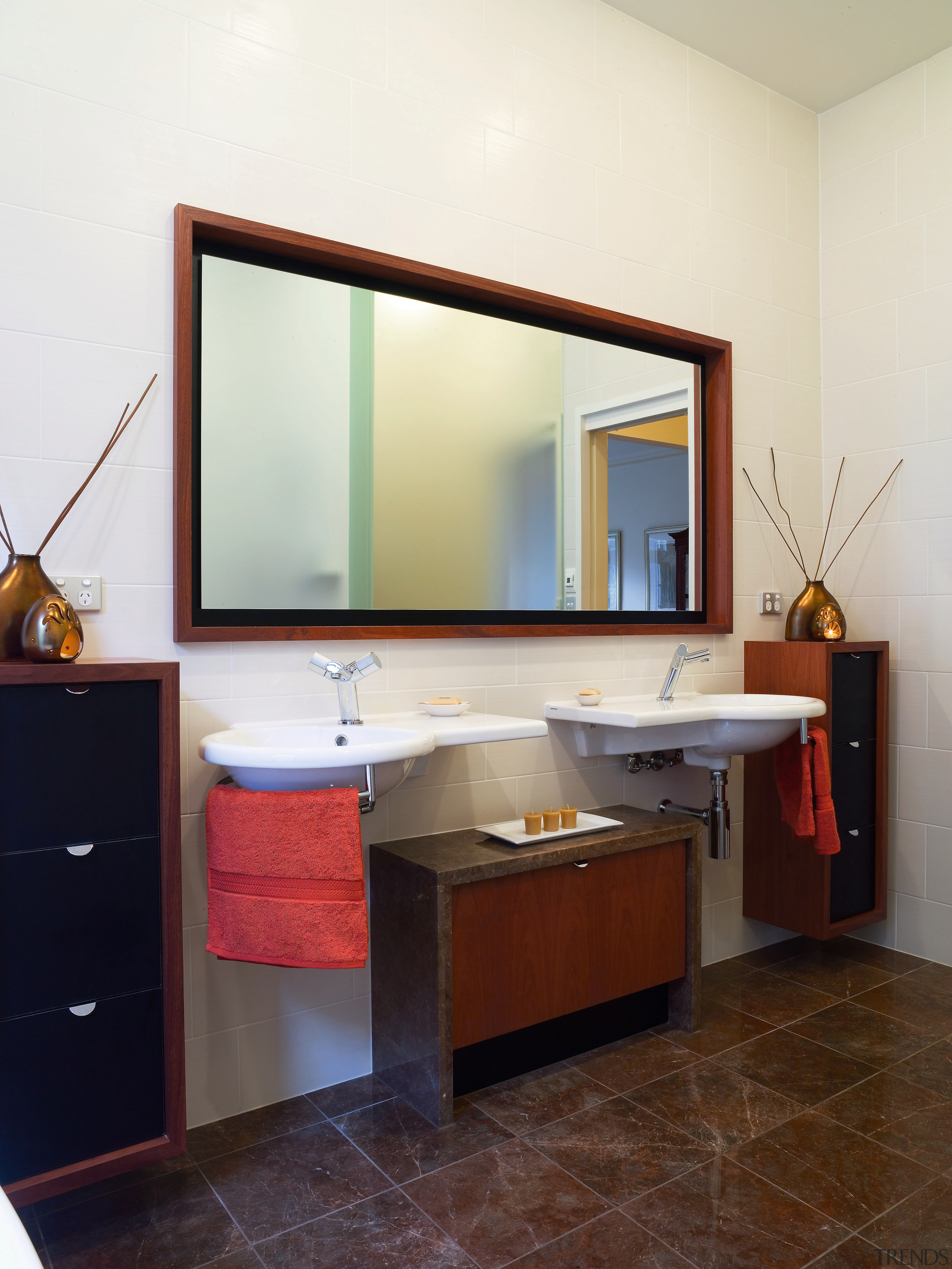 With its wall-hung basins and cabinets and freestanding bathroom, bathroom accessory, bathroom cabinet, cabinetry, floor, interior design, room, sink, white