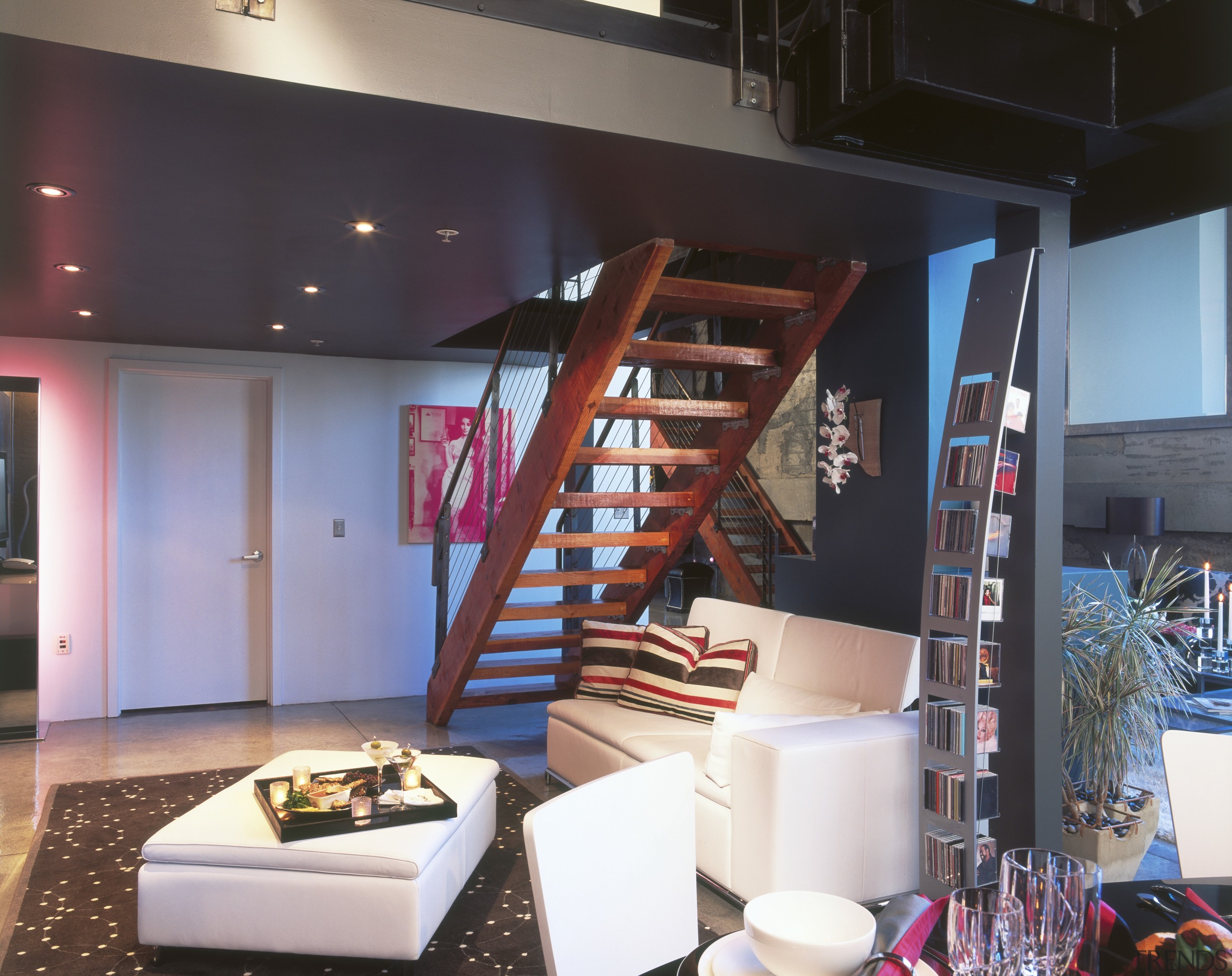 A view of the living area, concrete flooring, interior design, loft, black