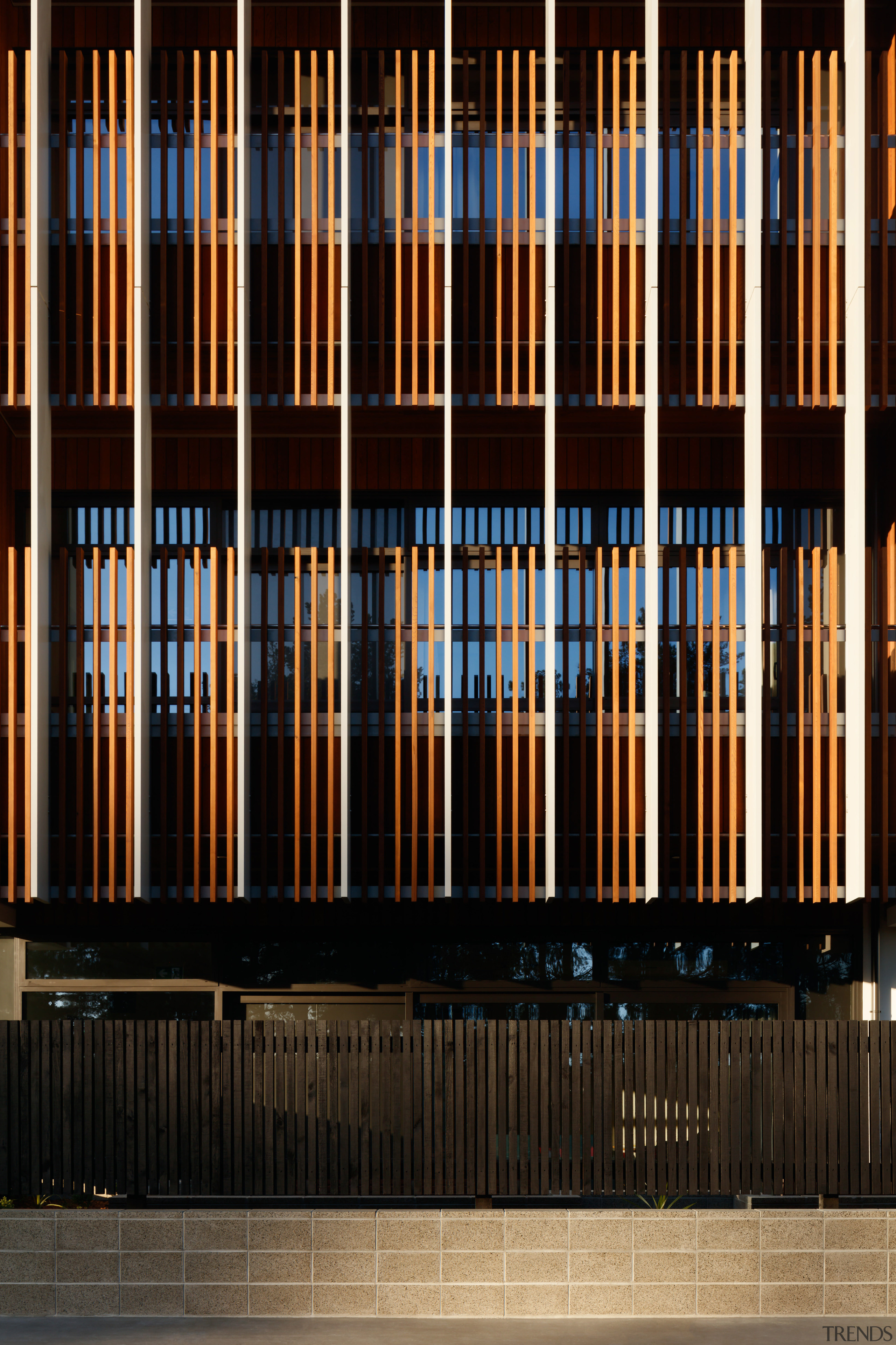 Timber slats seen from outside the atrium add architecture, line, black