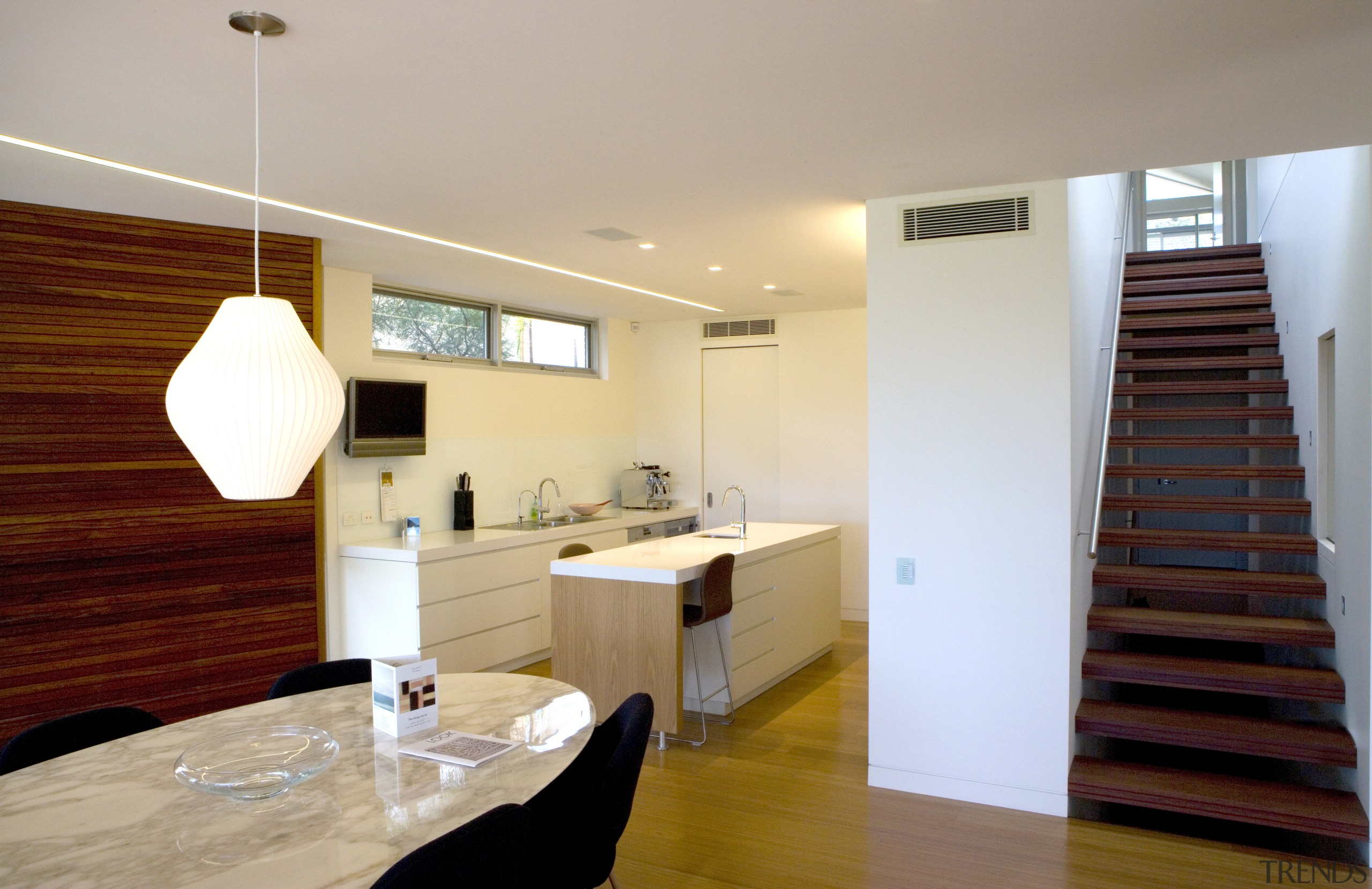 The thermal mass properties of the bricks mean apartment, architecture, ceiling, daylighting, floor, flooring, hardwood, home, house, interior design, property, real estate, room, wood, wood flooring, gray