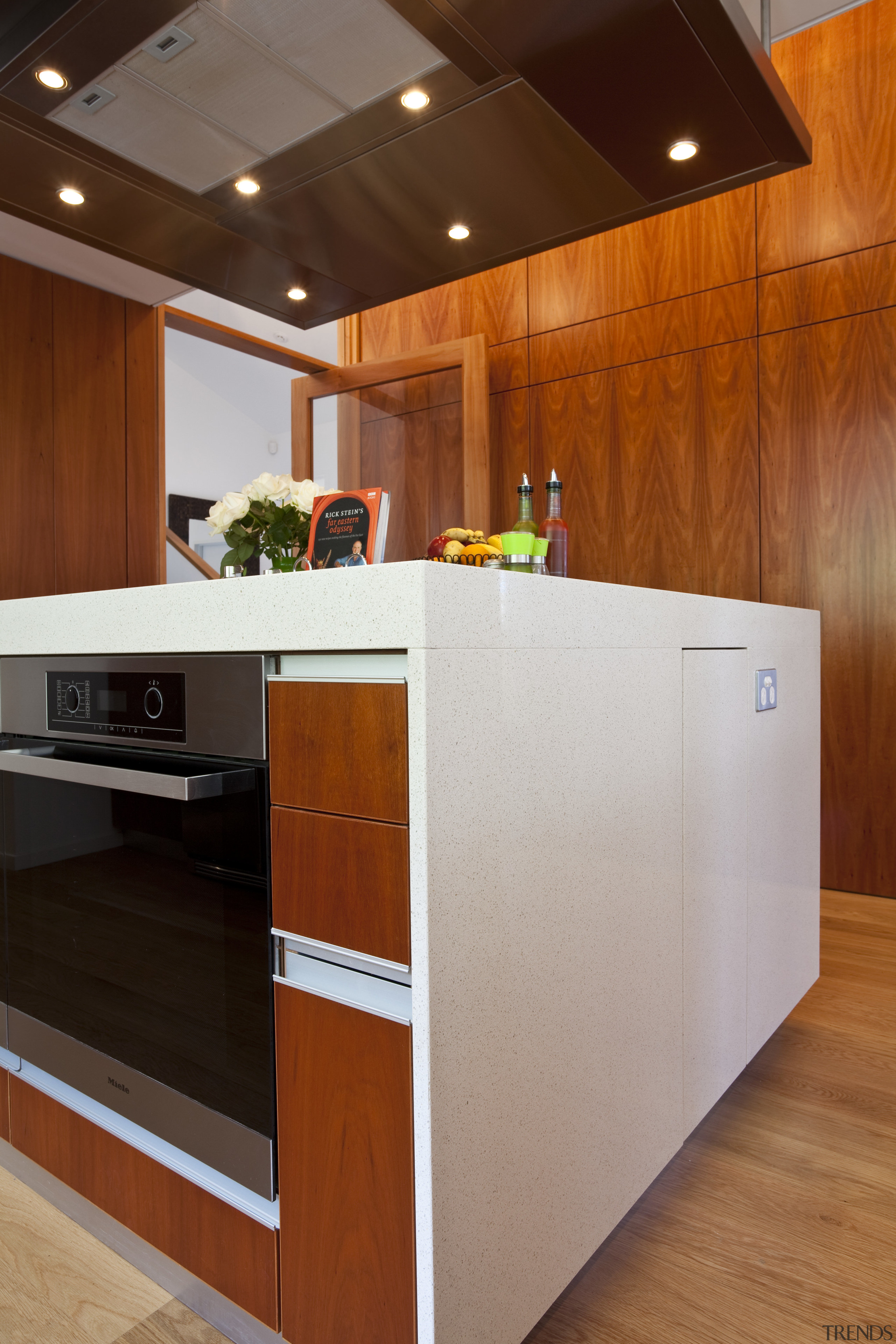 View of kitchen which features oak floors, kitchen cabinetry, countertop, floor, flooring, hardwood, interior design, kitchen, wood, brown