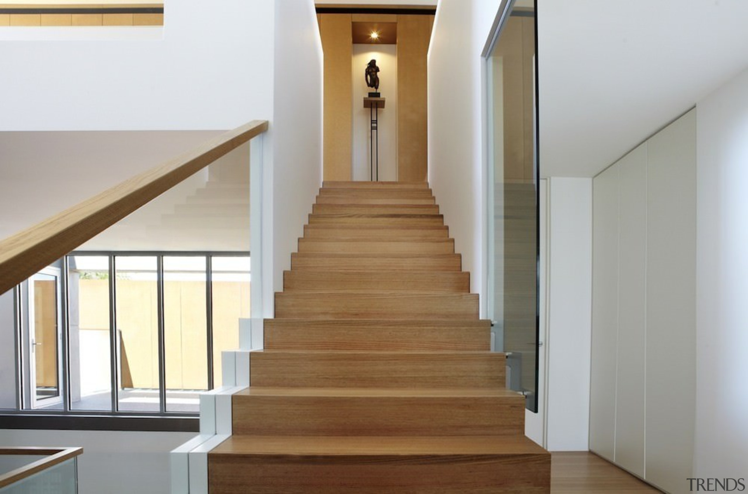 This simple staircase leads you up to the daylighting, floor, flooring, handrail, hardwood, home, house, interior design, laminate flooring, property, real estate, stairs, wood, wood flooring, gray, white, brown