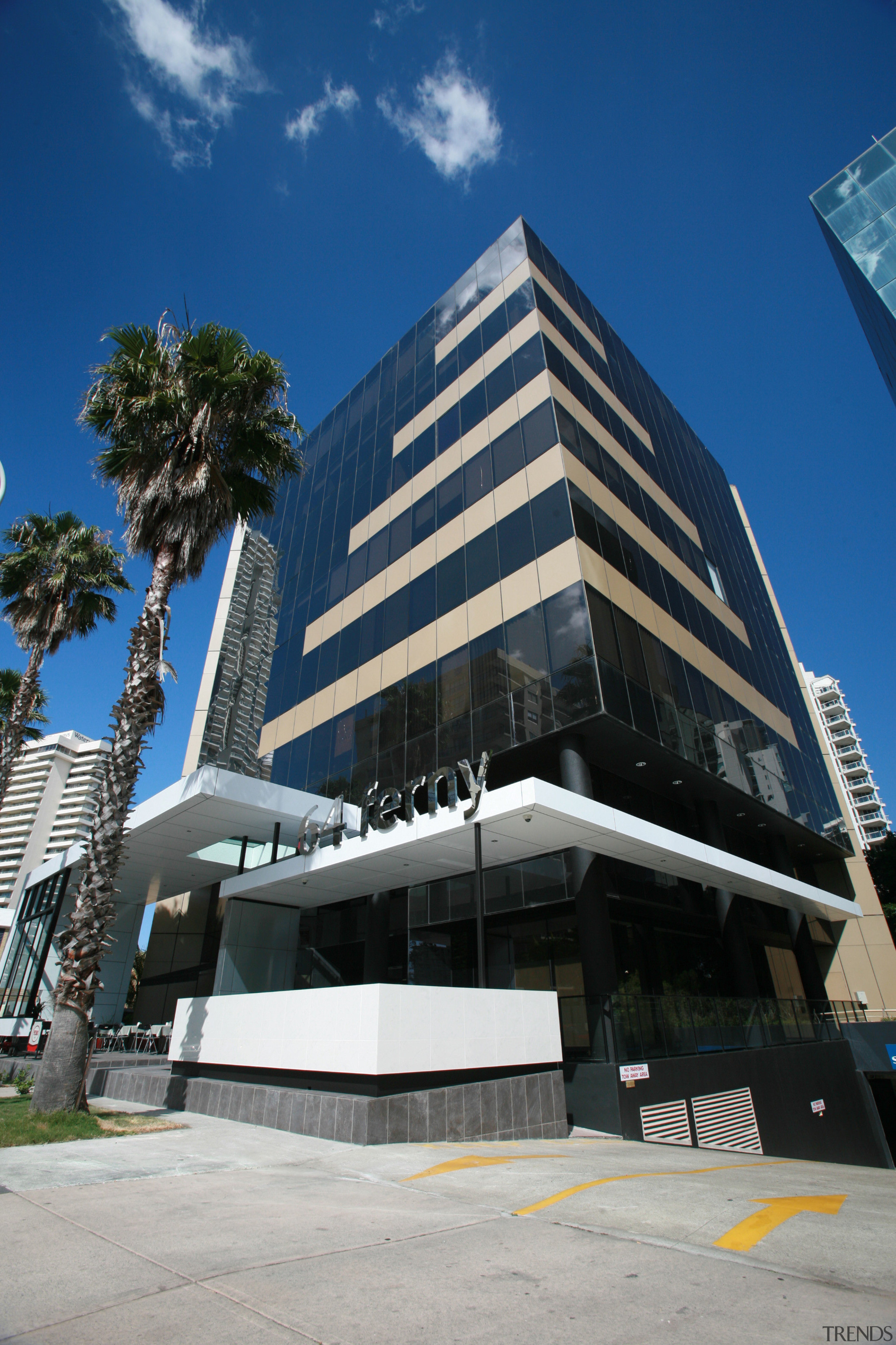 View of an office building which features a architecture, building, commercial building, condominium, corporate headquarters, daytime, facade, headquarters, hotel, landmark, metropolitan area, mixed use, real estate, sky, blue