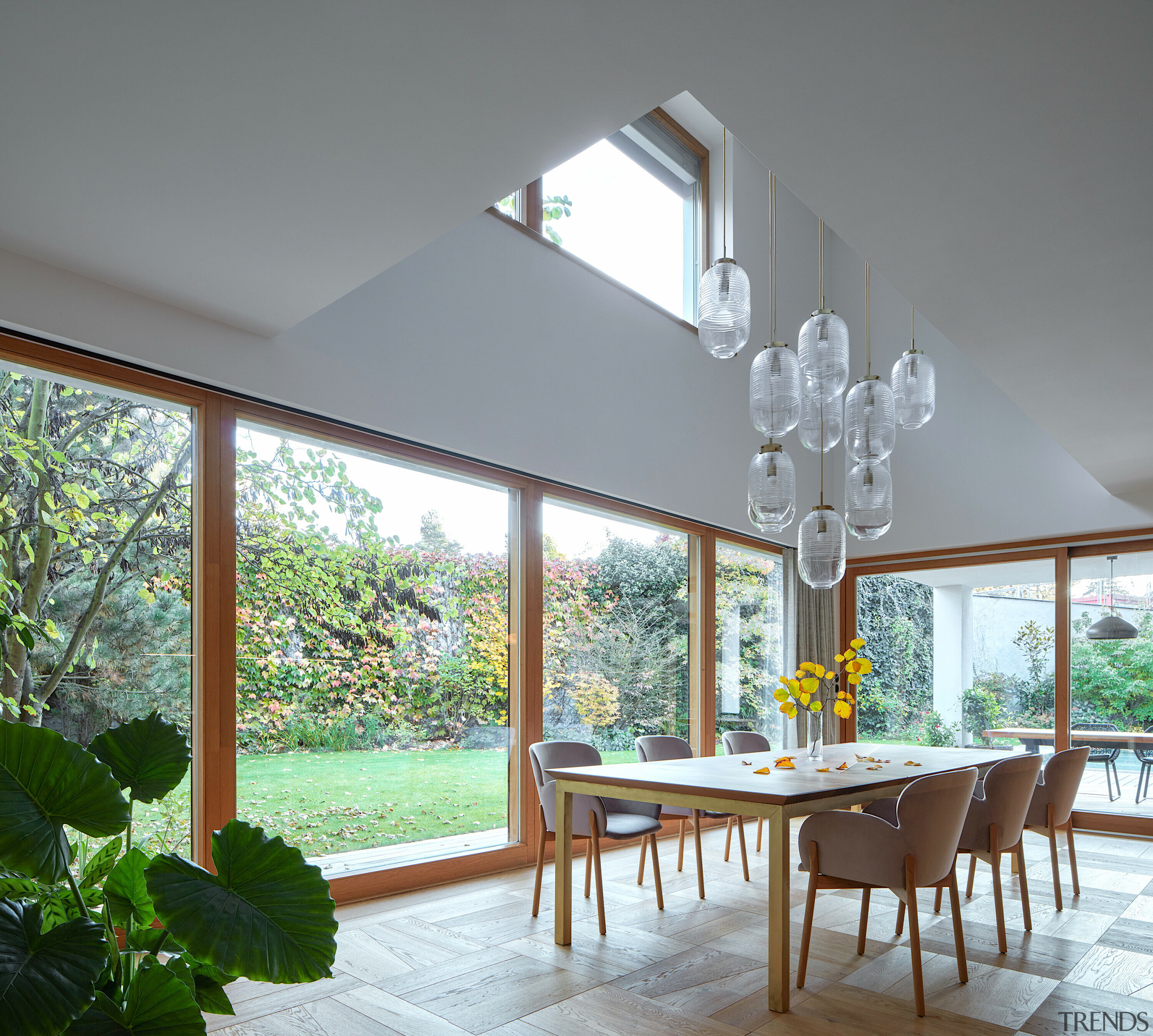 Dining under a double-height void. - Heart of 