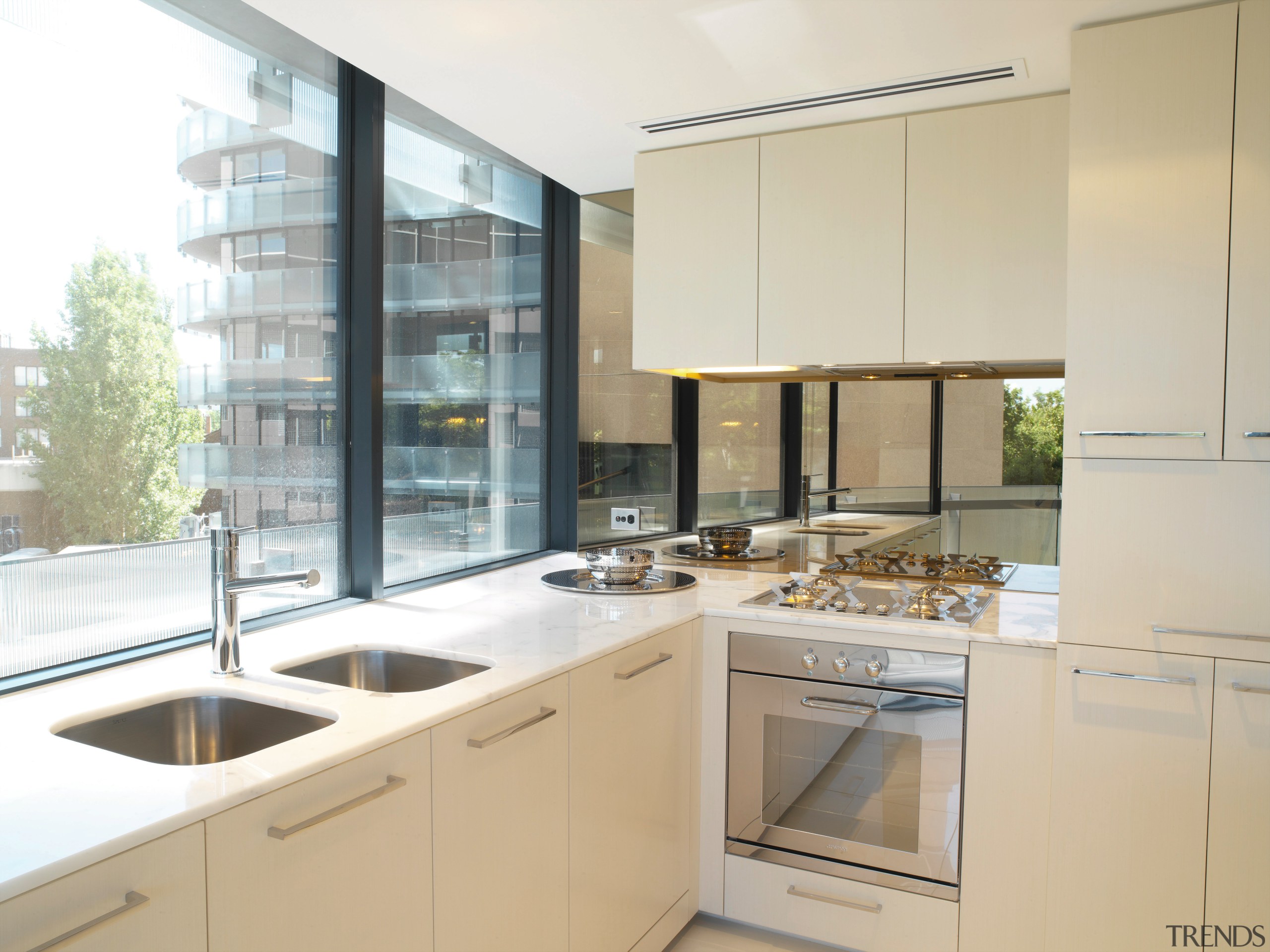 Kitchen with cream cabinetry, white benchtop, twin sinks, cabinetry, countertop, cuisine classique, interior design, kitchen, property, real estate, white