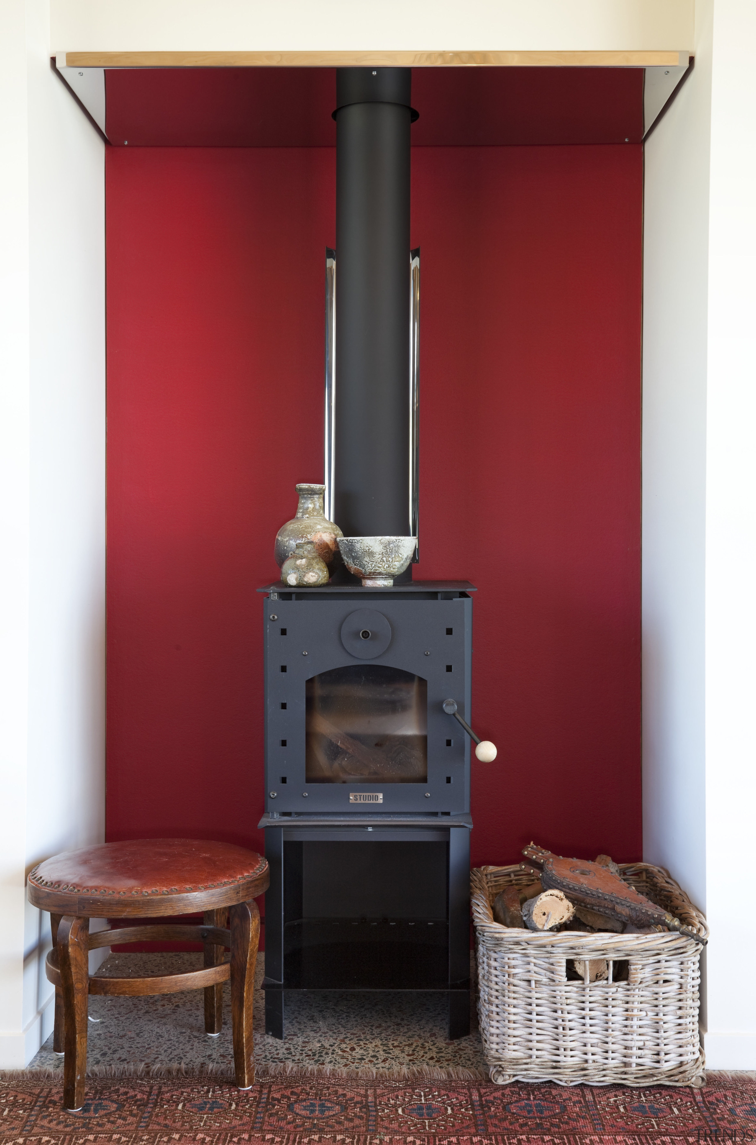 Chimney with red feature wall and low wooden fireplace, hearth, home appliance, kitchen stove, stove, wood burning stove, red, white