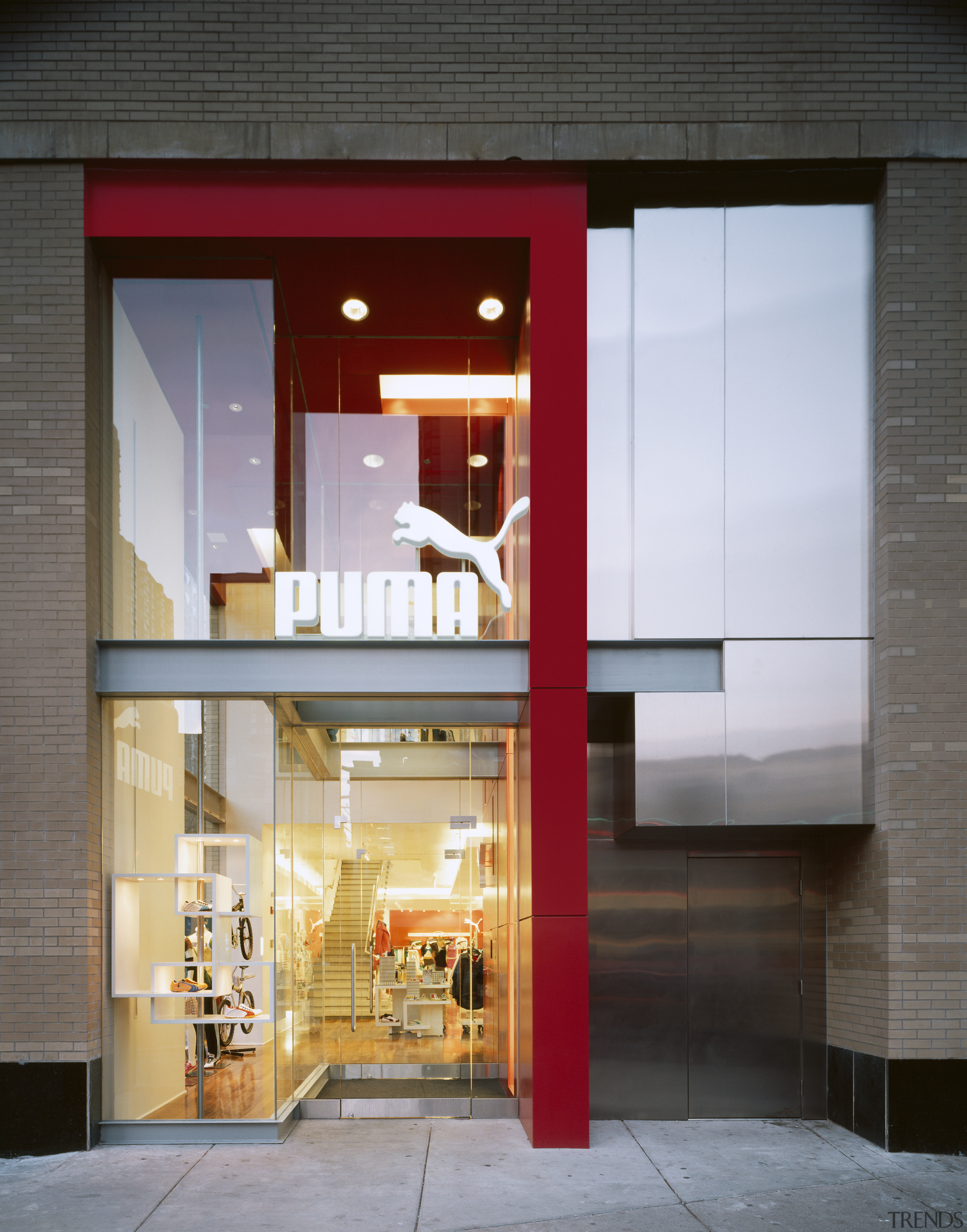 An exterior viow of the puma shopfront,  architecture, door, facade, house, interior design, window, gray