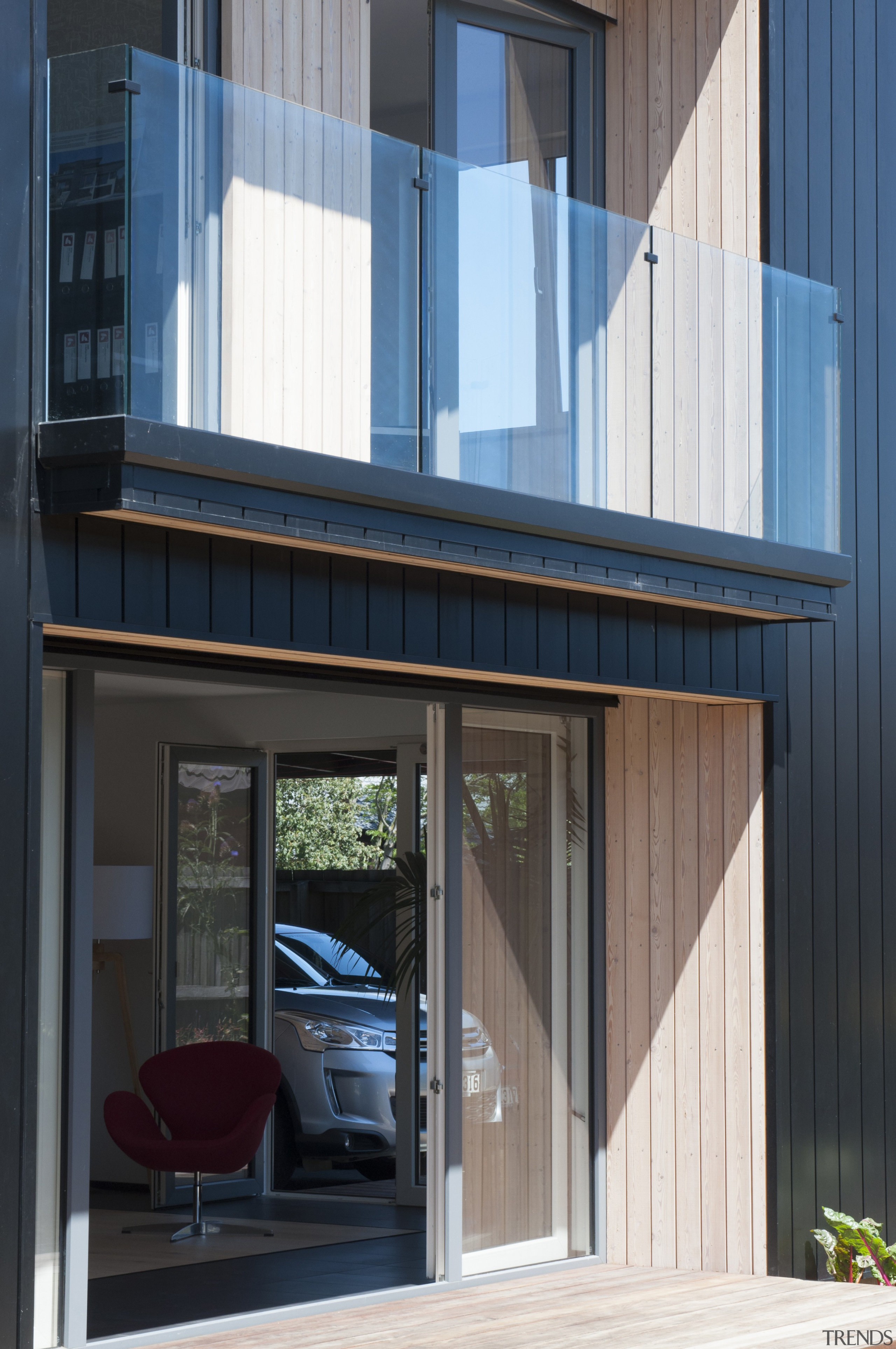 This exterior view of the home features the architecture, door, facade, house, siding, window, black