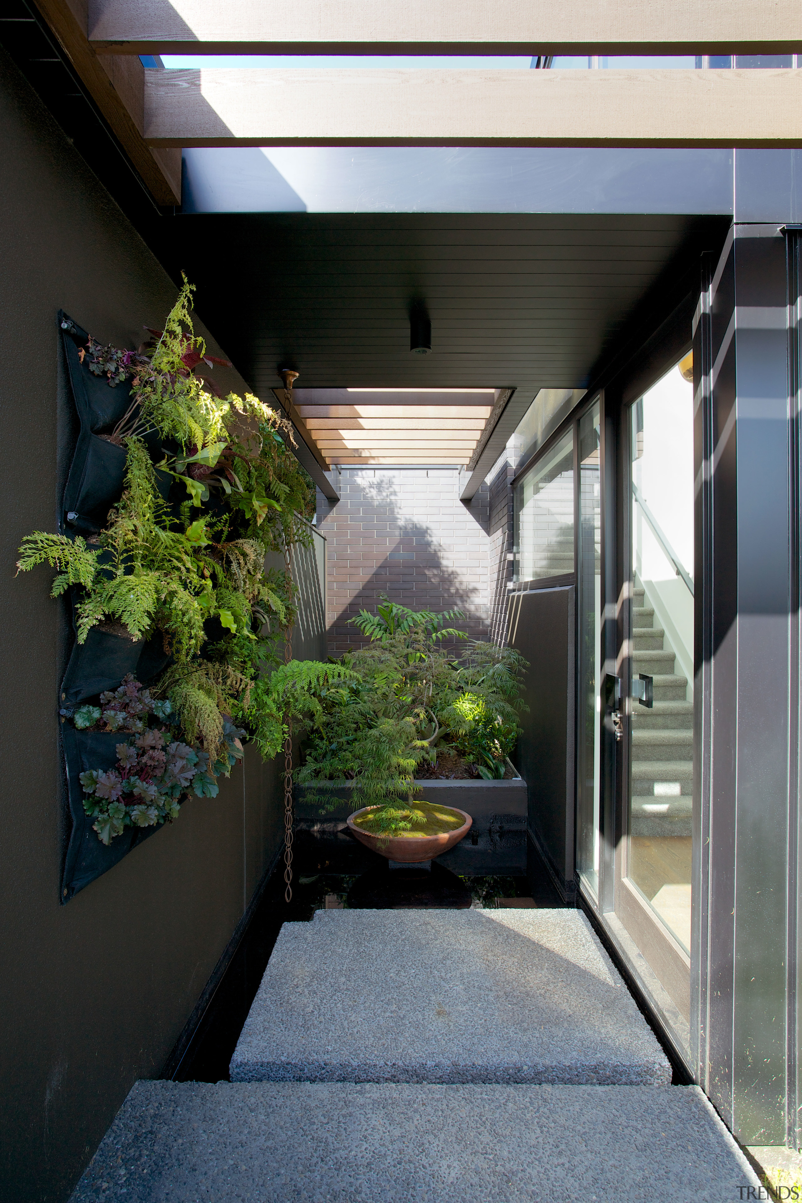 Large steps and an ornamental pond provide a architecture, courtyard, home, house, window, black, gray