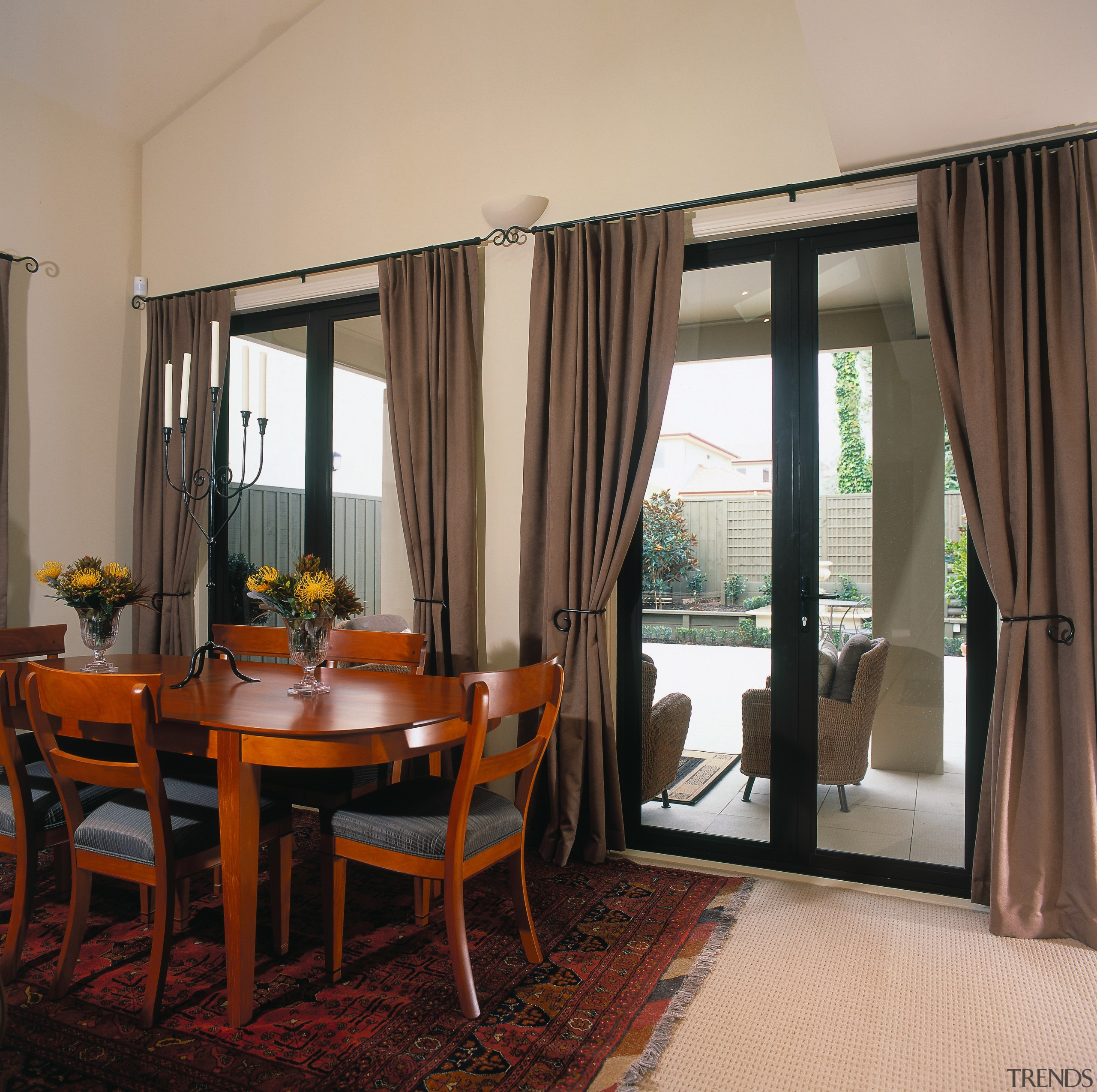 view of the dining area that opens out curtain, dining room, door, interior design, living room, real estate, room, window, window covering, window treatment, orange, black