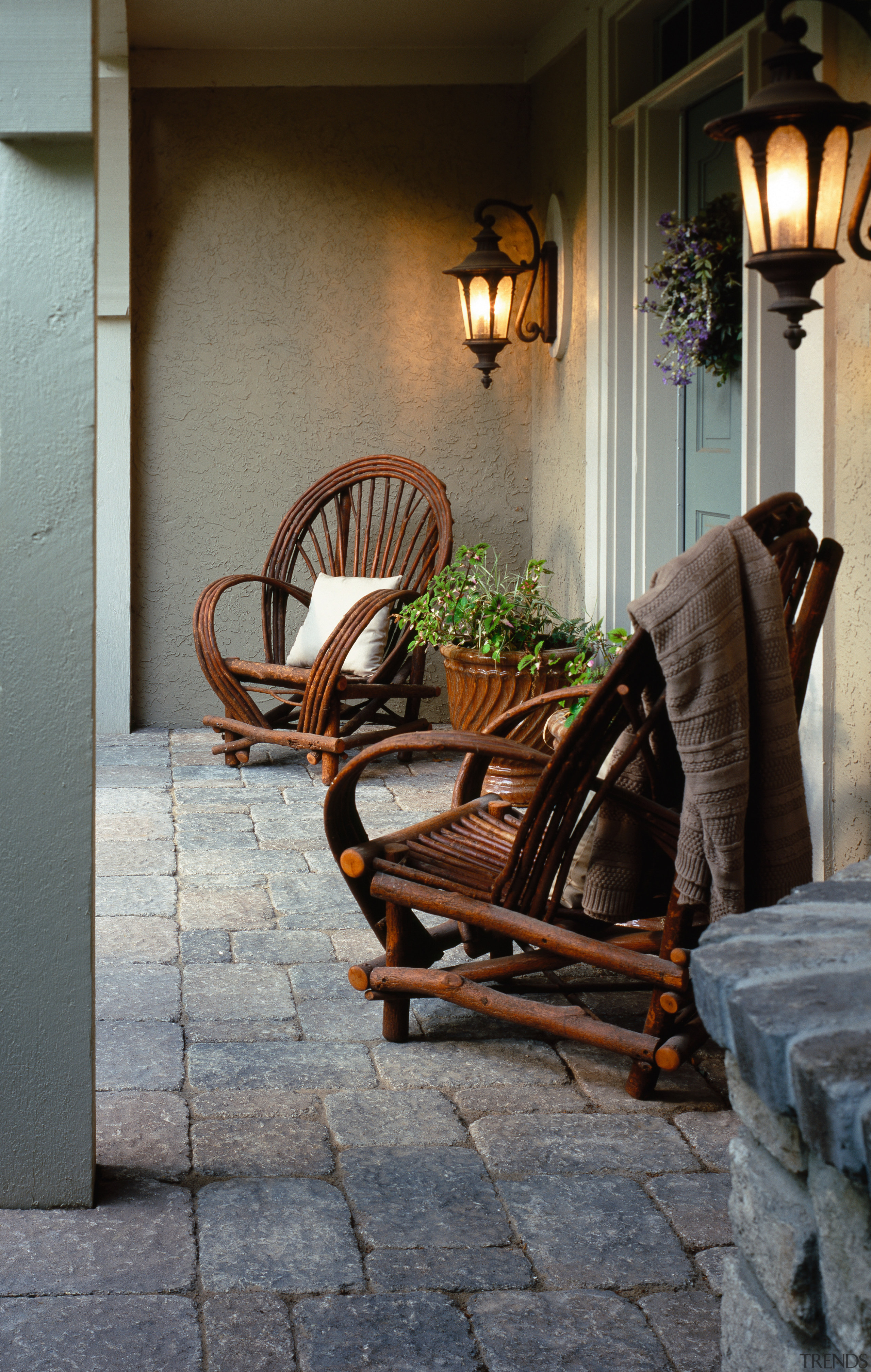 View of two cane chairs in patio area chair, floor, flooring, furniture, home, house, interior design, living room, table, wall, window, wood, gray