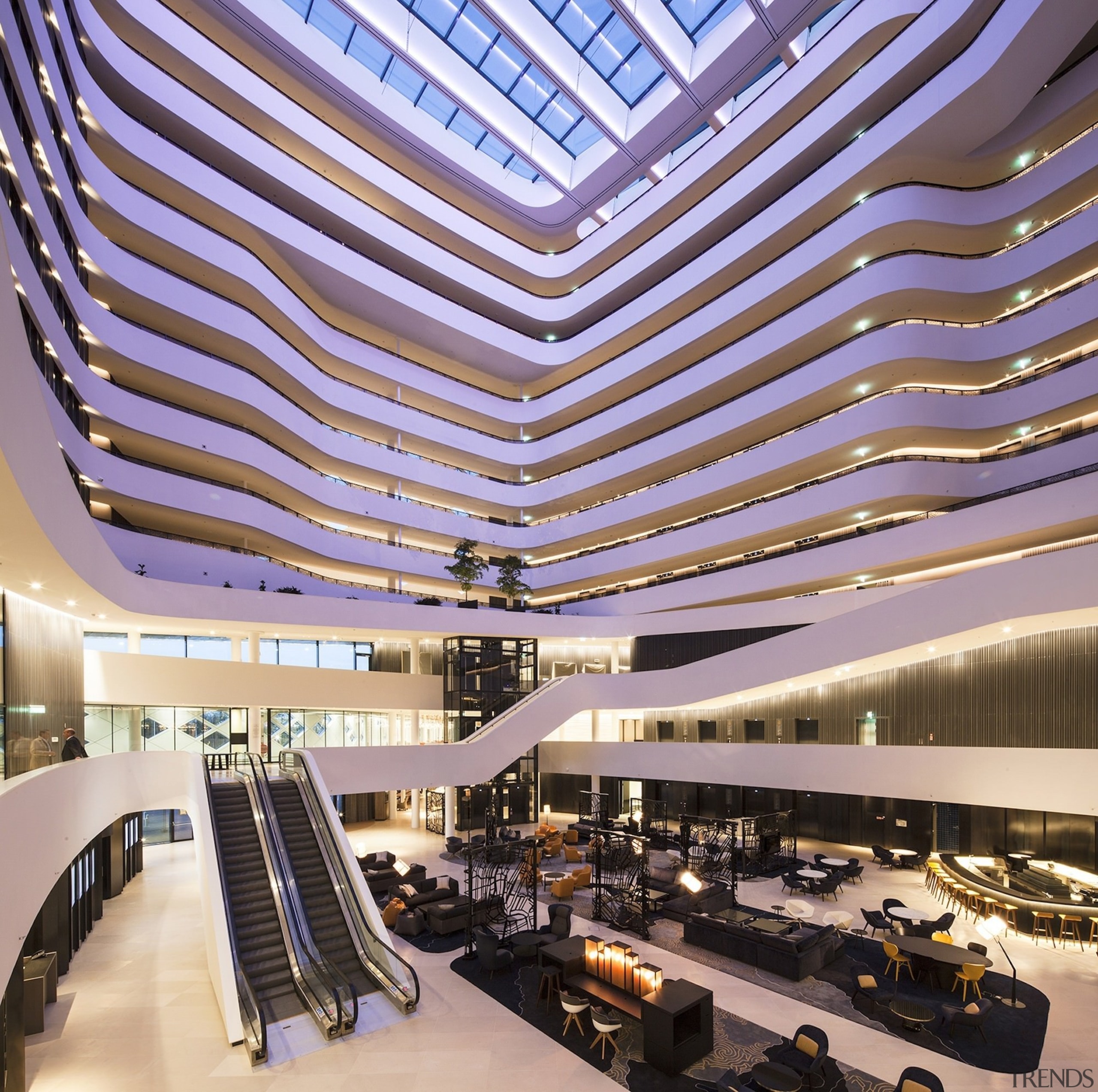 The lobby at night - The lobby at architecture, building, ceiling, convention center, corporate headquarters, daylighting, headquarters, lobby, mixed use, shopping mall, purple