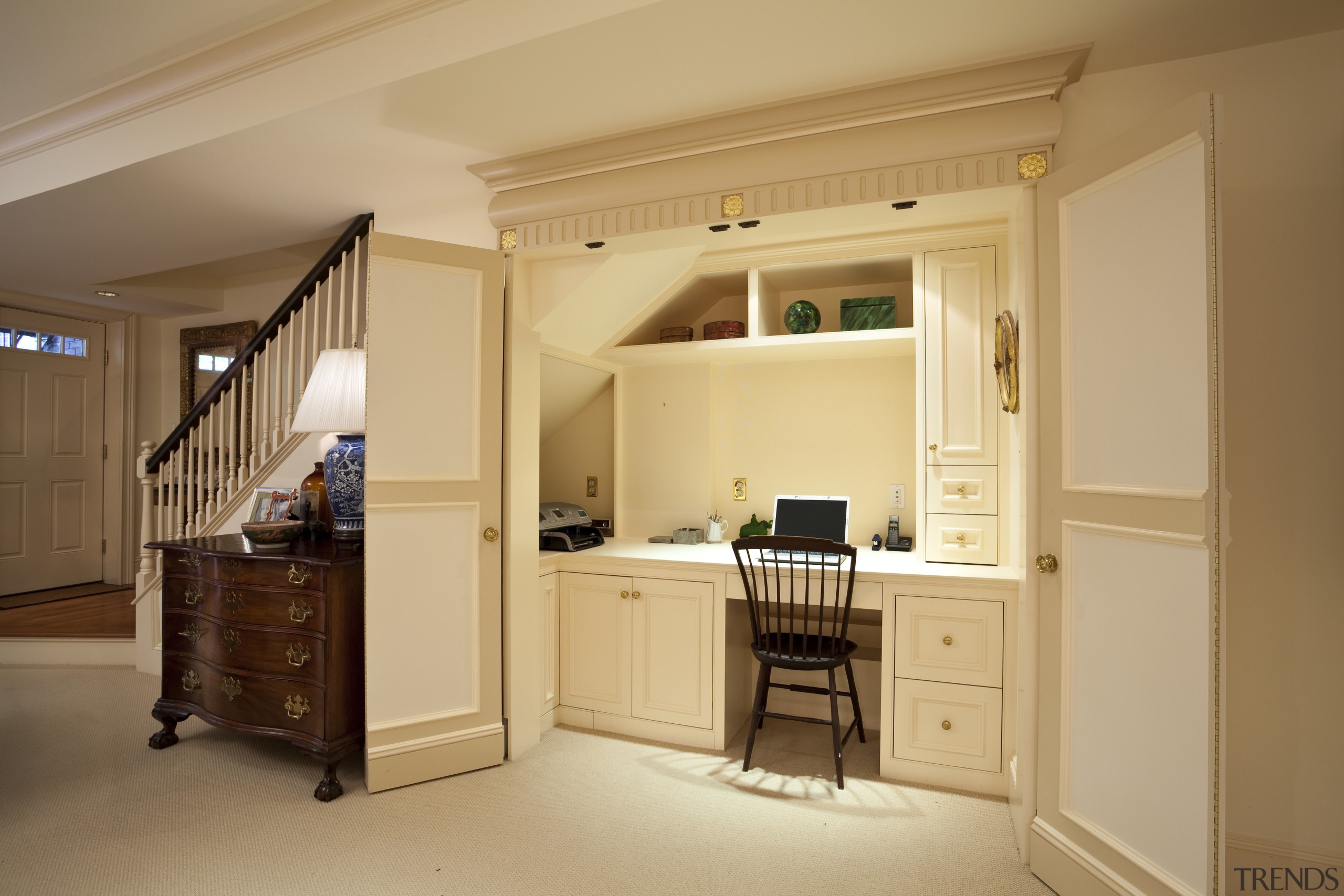 View of desk area under a staircase. - cabinetry, ceiling, floor, flooring, furniture, home, interior design, real estate, room, orange, brown