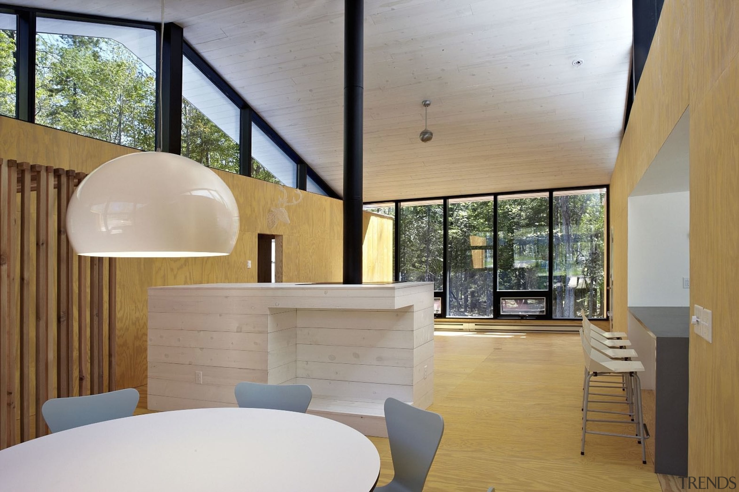 A large hanging light is the centrepiece of architecture, ceiling, daylighting, house, interior design, real estate, gray, brown