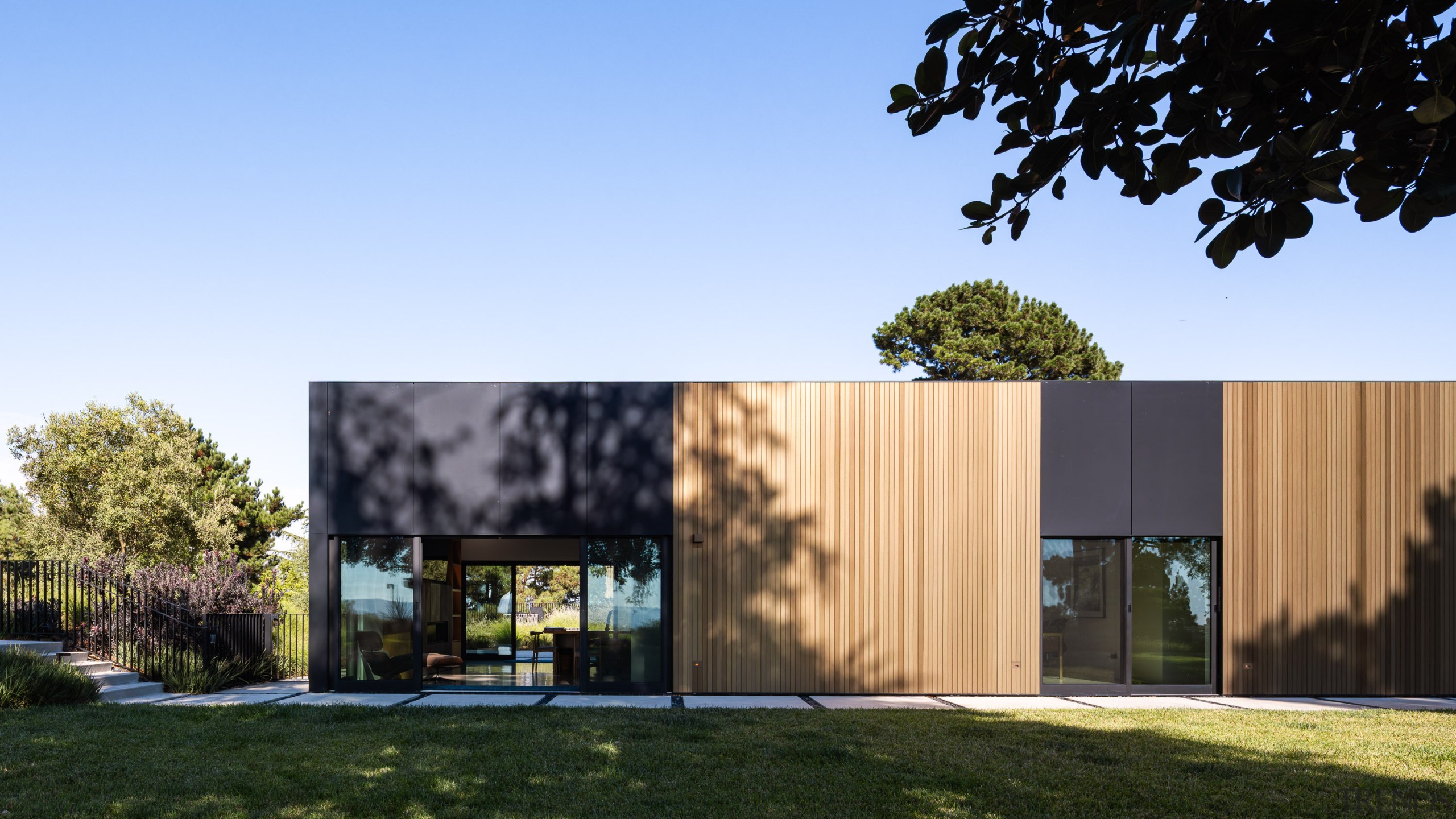 Thanks to shared materiality, the studio/guest house is 