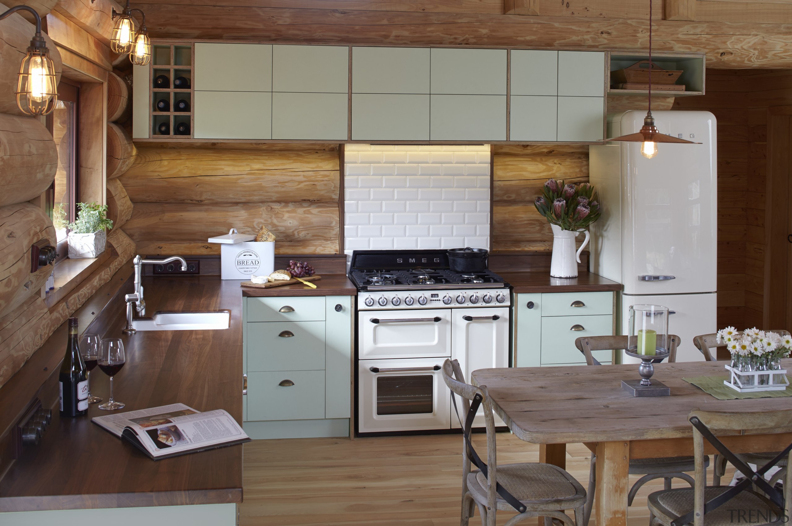 The cabinetry in this log cabin has been cabinetry, countertop, cuisine classique, interior design, kitchen, room, brown, gray