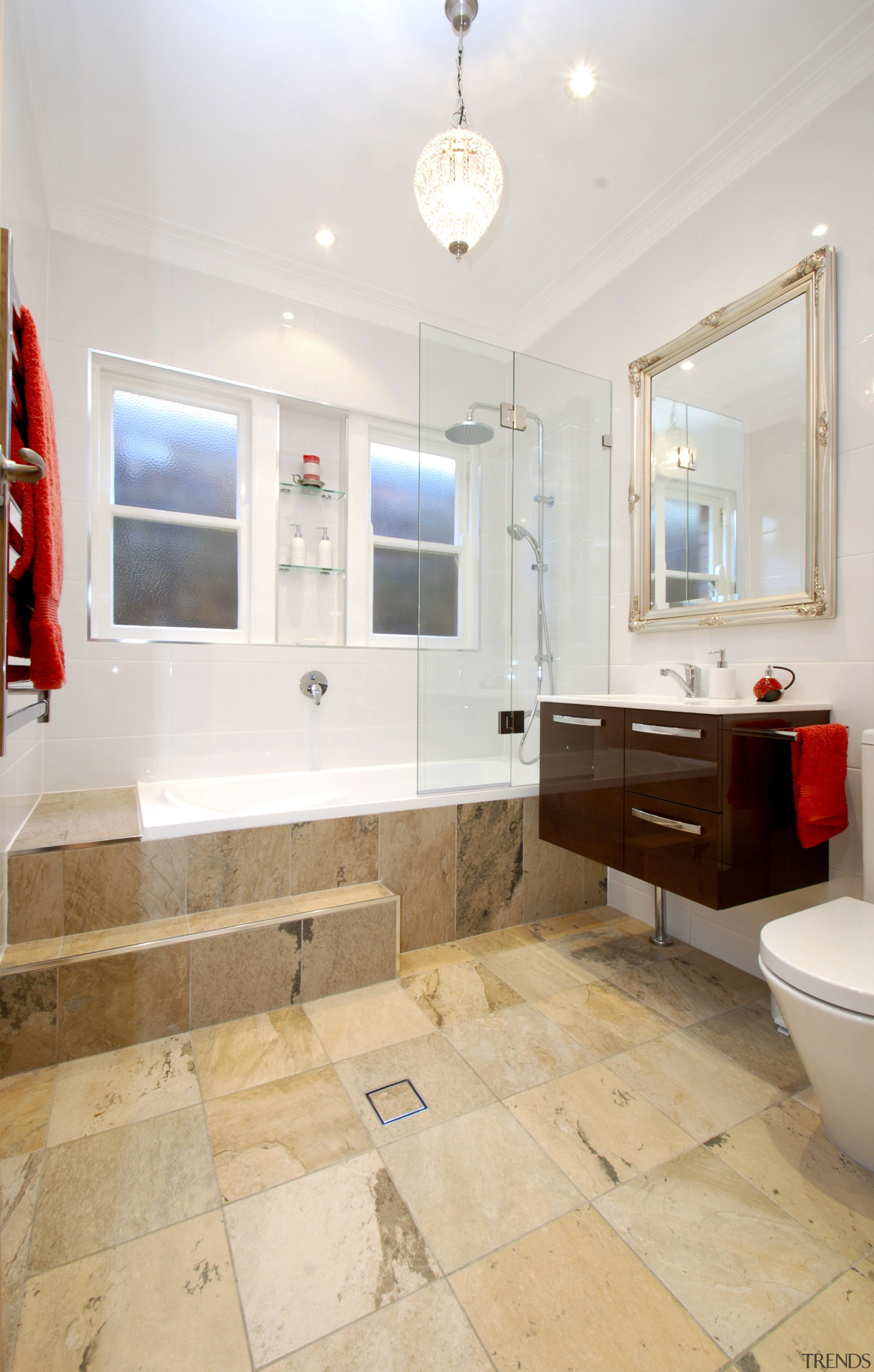 tiled bathroom, dark wood vanity, stepped shower enclosure bathroom, floor, flooring, home, interior design, property, real estate, room, sink, tile, wood flooring, white