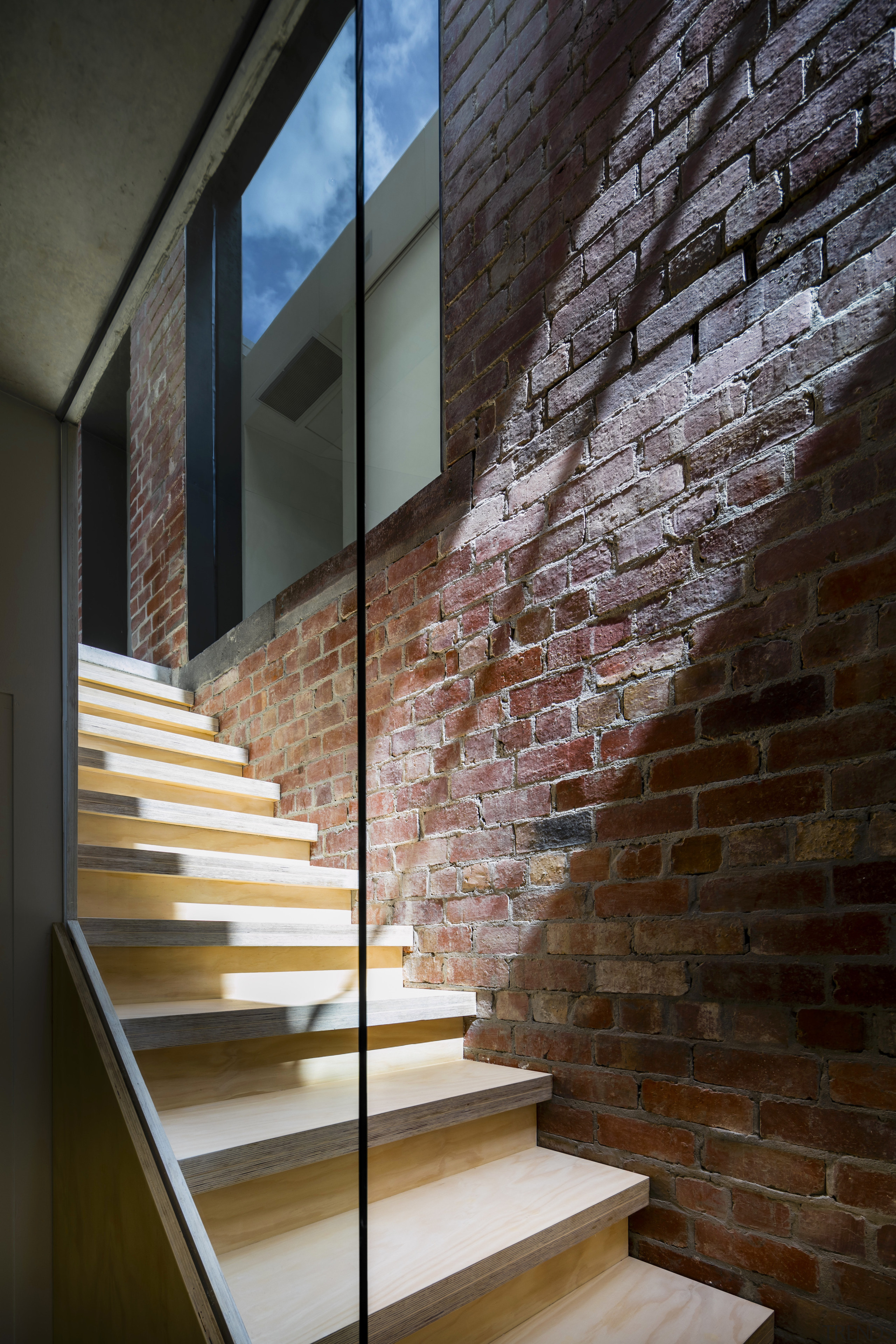 Looking up the stairs with a window to 
