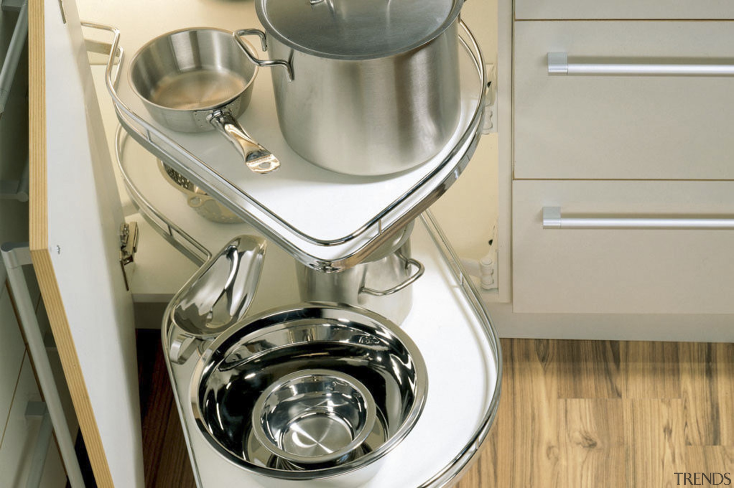 View of kitchen cabinetry with Hettich hardware and cookware and bakeware, home appliance, kitchen appliance, mixer, plumbing fixture, product design, sink, small appliance, gray, brown