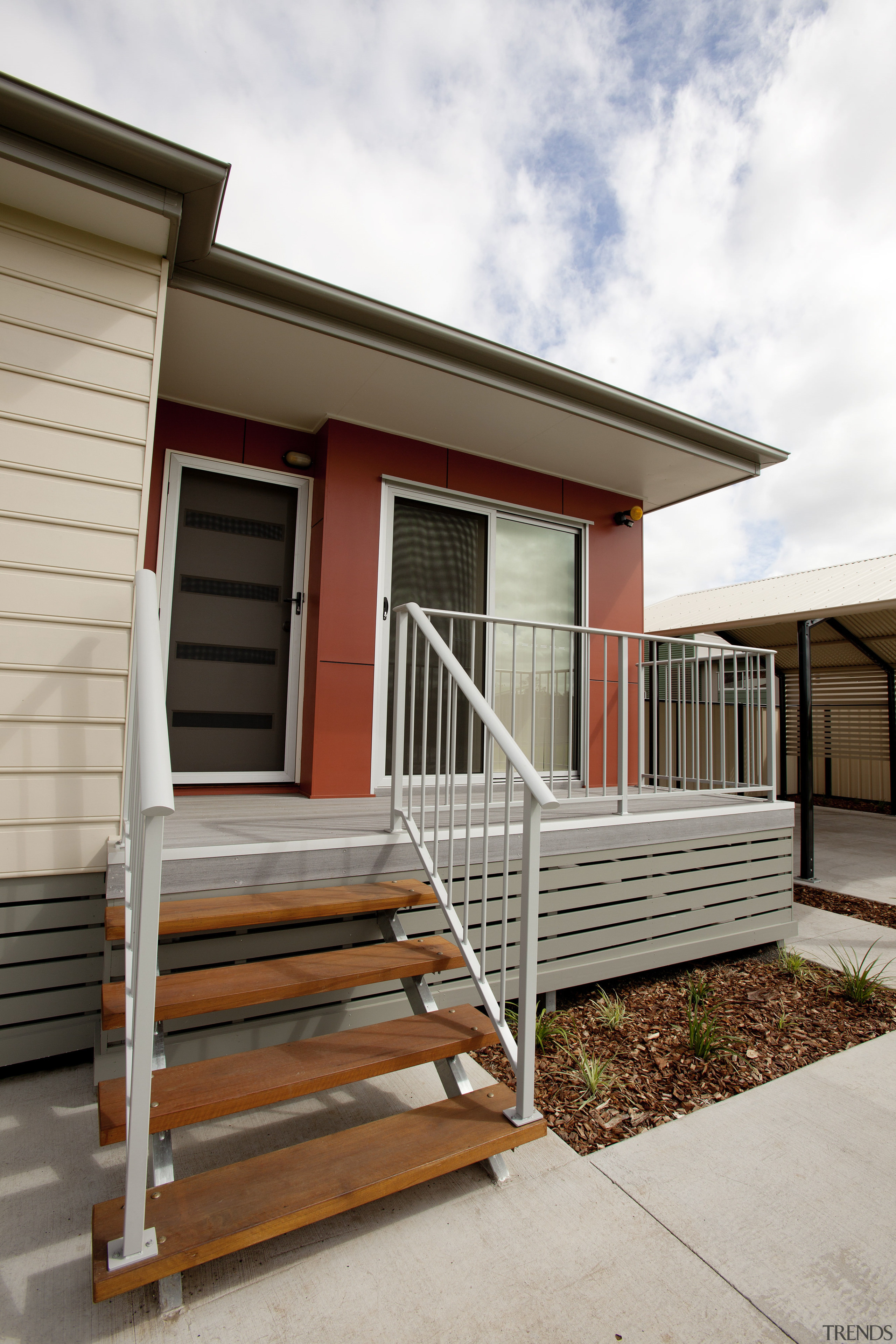 View of building by Hutchinson Builders. - View building, facade, handrail, home, house, porch, property, real estate, residential area, siding, stairs, window, white