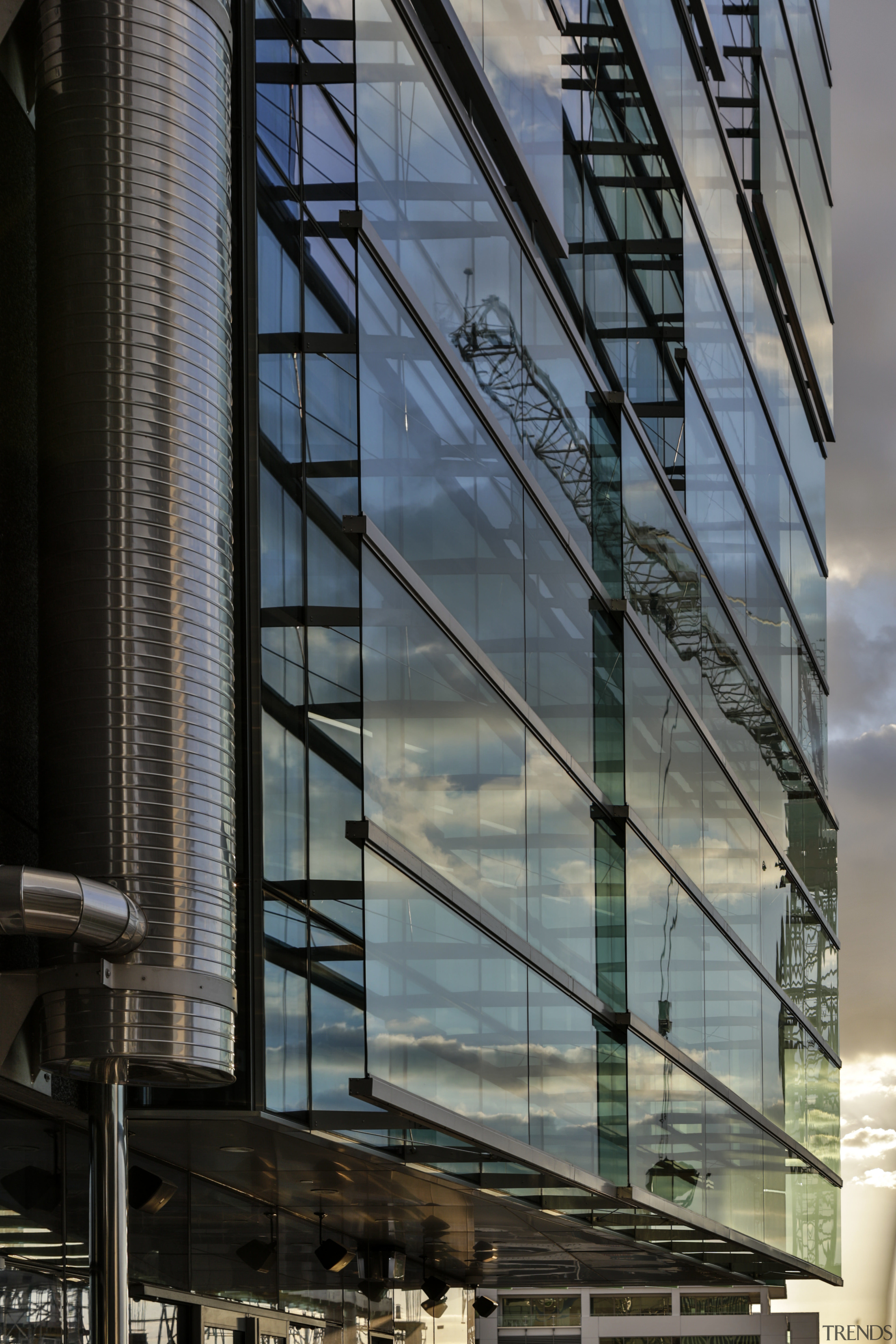 Detail of one of the facades on the architecture, building, city, commercial building, condominium, corporate headquarters, daytime, facade, glass, headquarters, metropolis, metropolitan area, mixed use, reflection, residential area, sky, skyscraper, structure, tower block, urban area, window, gray, black