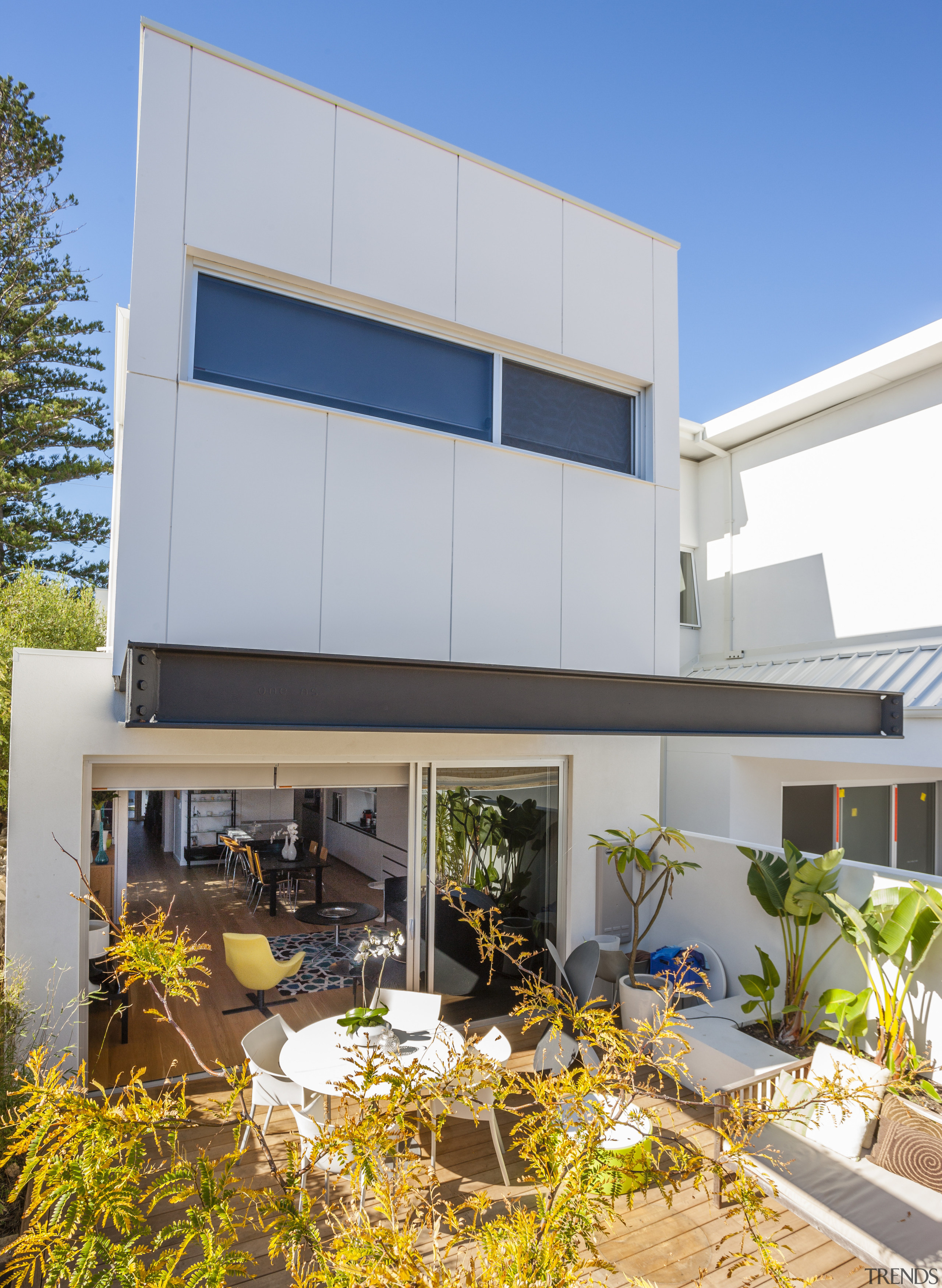 The ground floor of this terrace-style home opens architecture, building, elevation, facade, home, house, property, real estate, residential area, window, gray