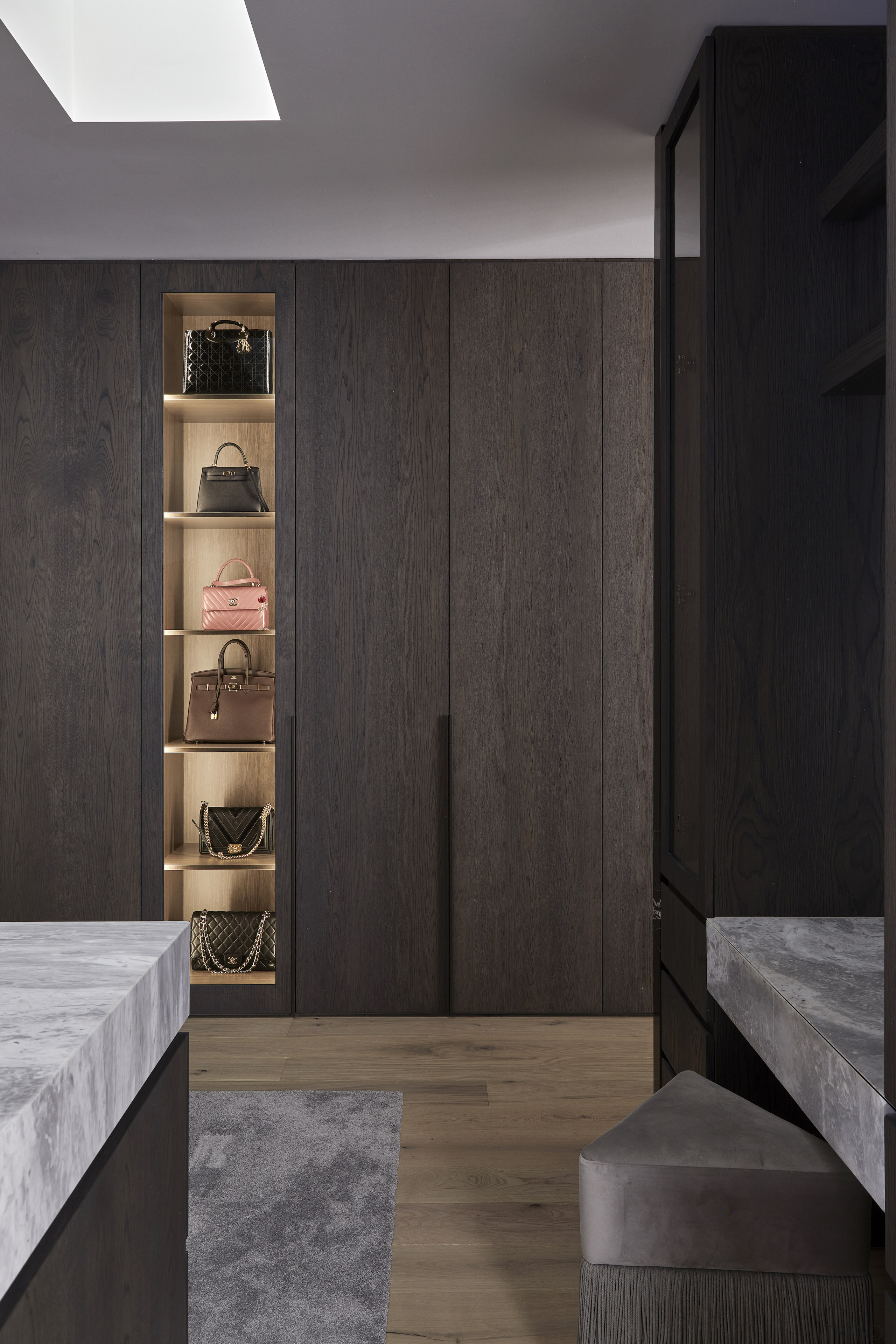 Dressing room with back-lit display shelving. 