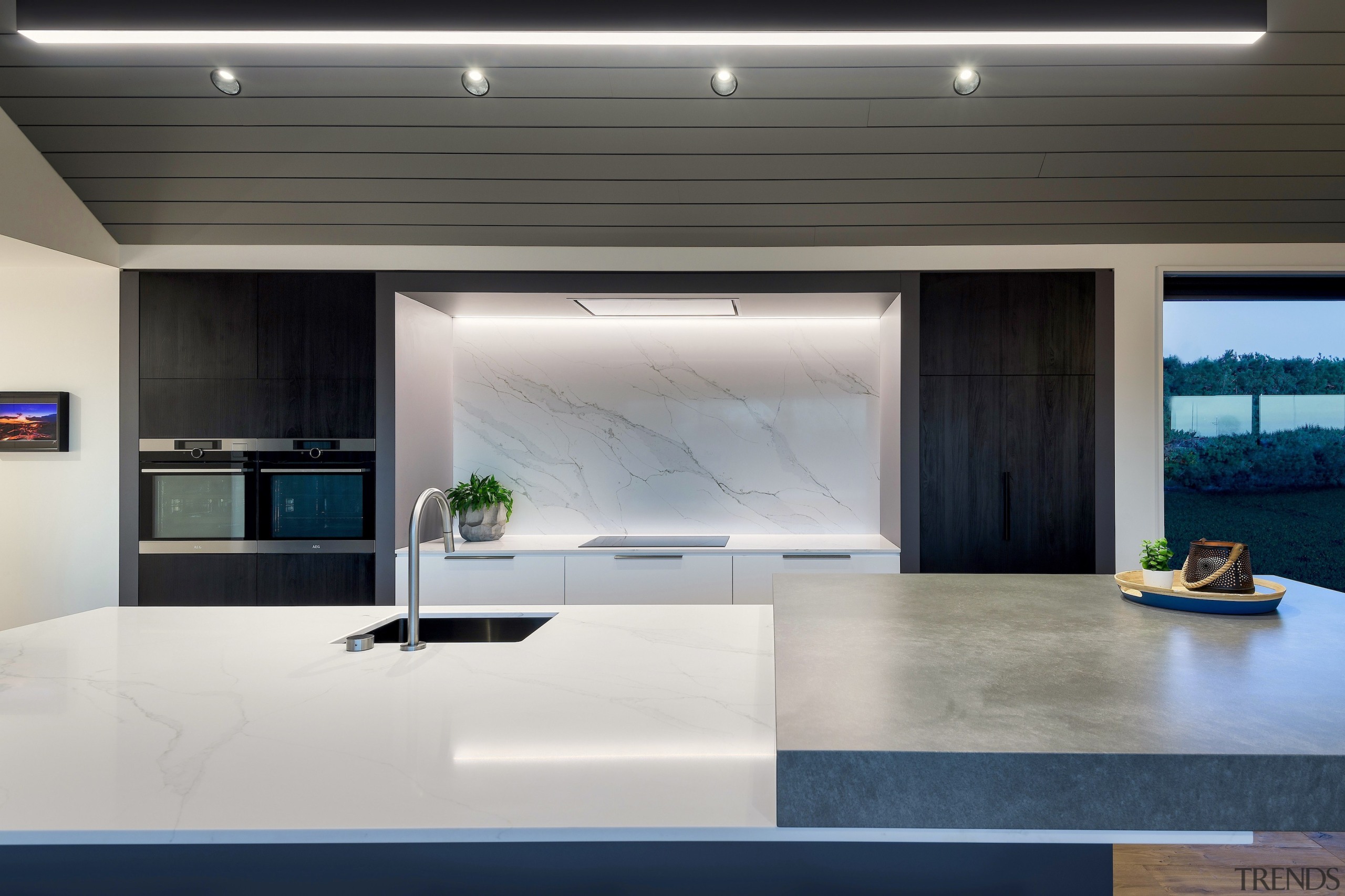 The dark textured solid wall of joinery includes 