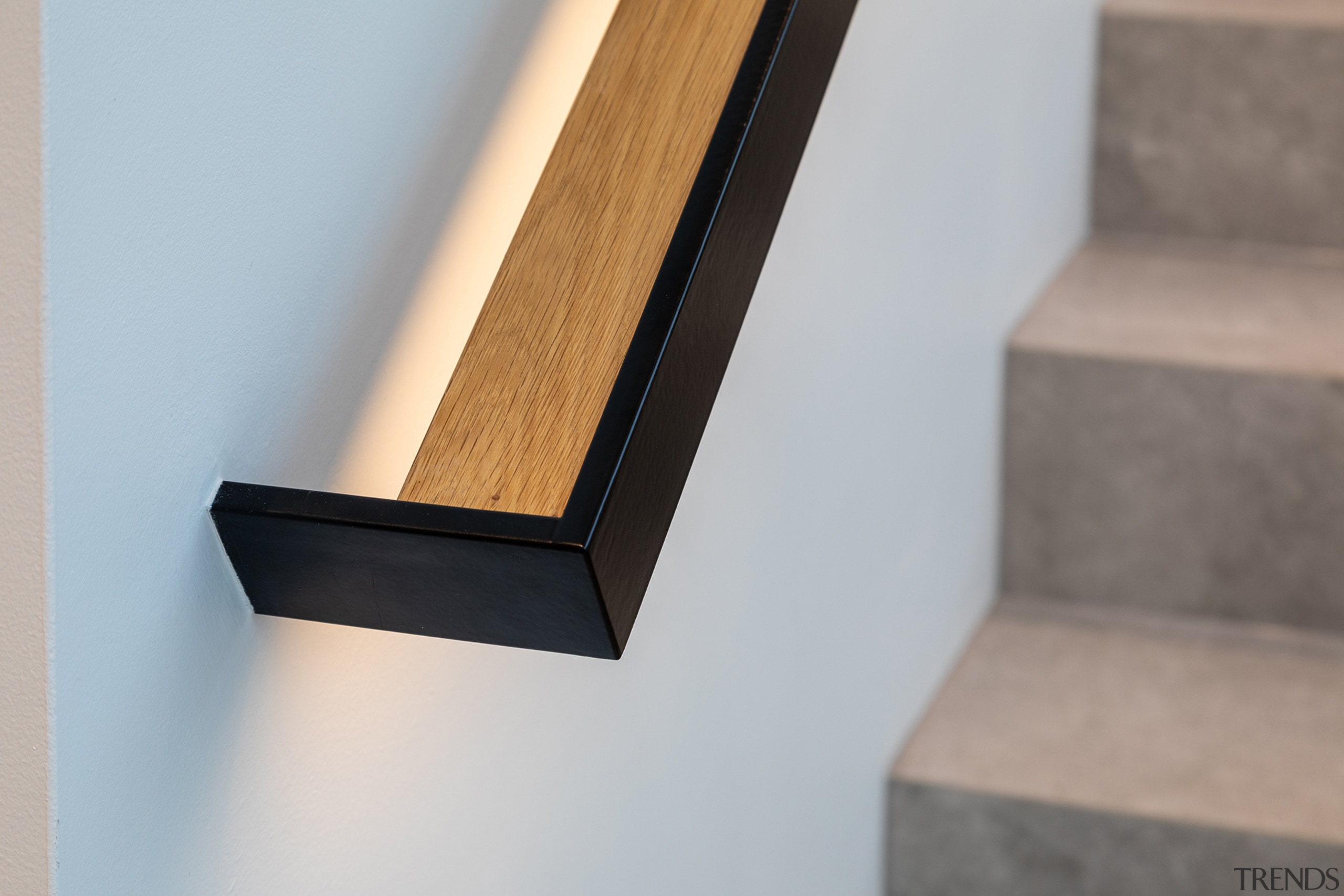 Stair detail showing under-lit bannister. - Bespoke and 