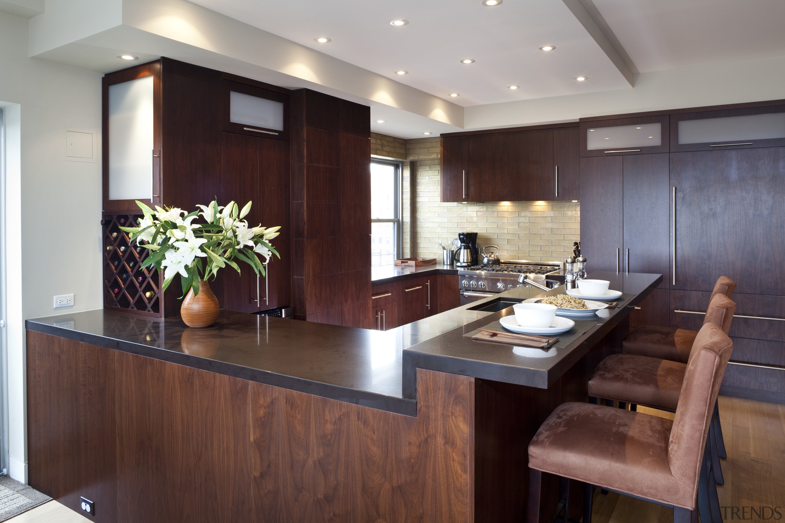 Dark wooden cabinetry, dark coloured benchtop, white walls cabinetry, countertop, interior design, kitchen, real estate, room, red, gray