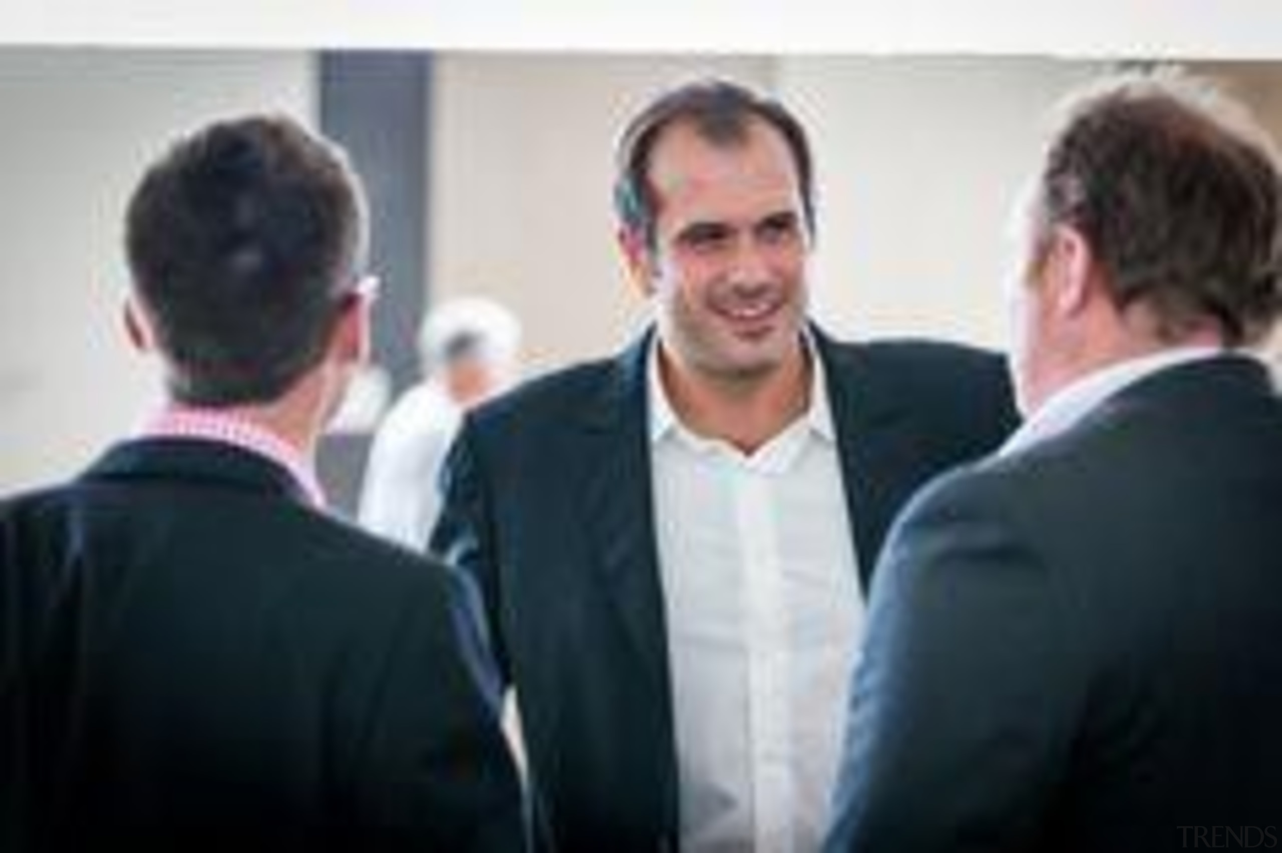 Saverio Vaccari, centre, from Laminam Italy. - Saverio business, business executive, businessperson, communication, conversation, entrepreneur, formal wear, professional, public relations, suit, white collar worker, black, white