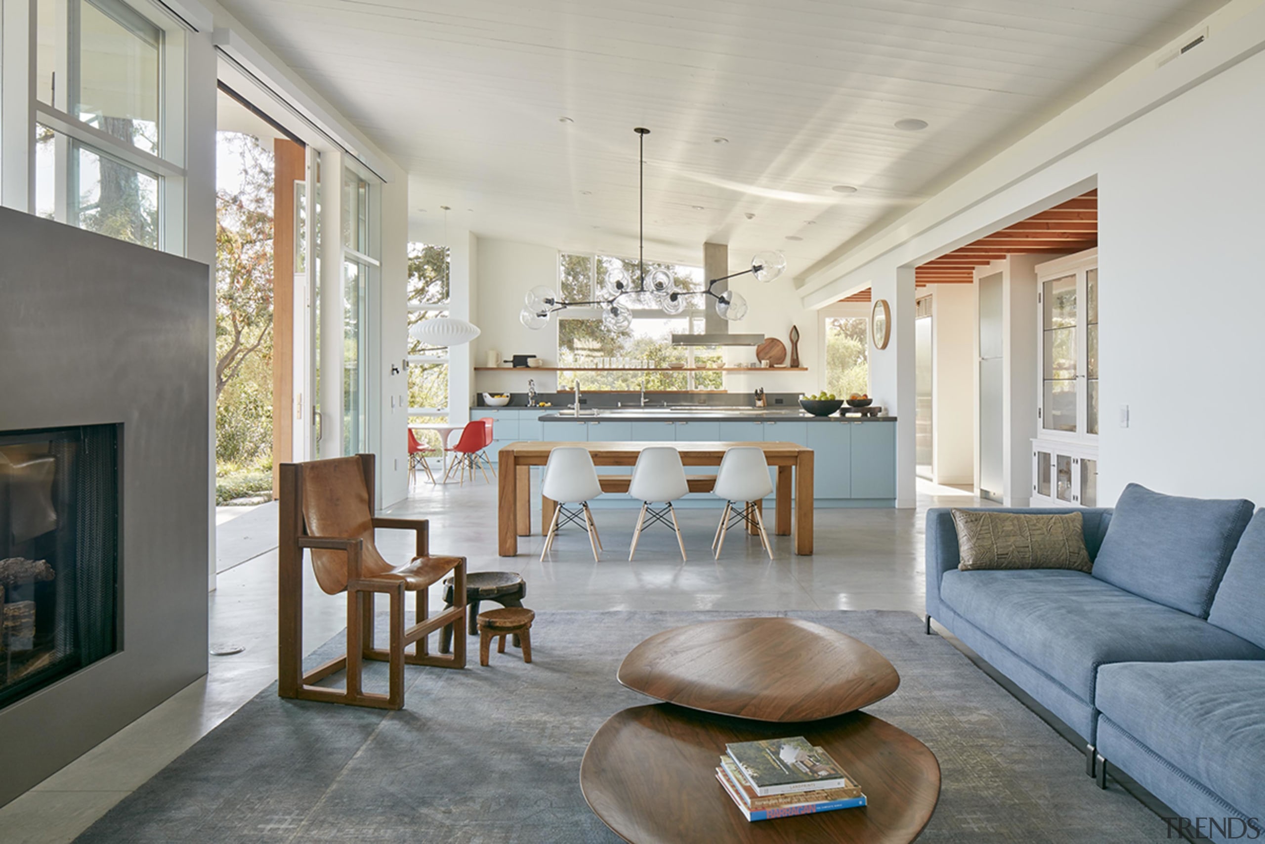 This MDa-designed home's open-concept living room, dining room, 