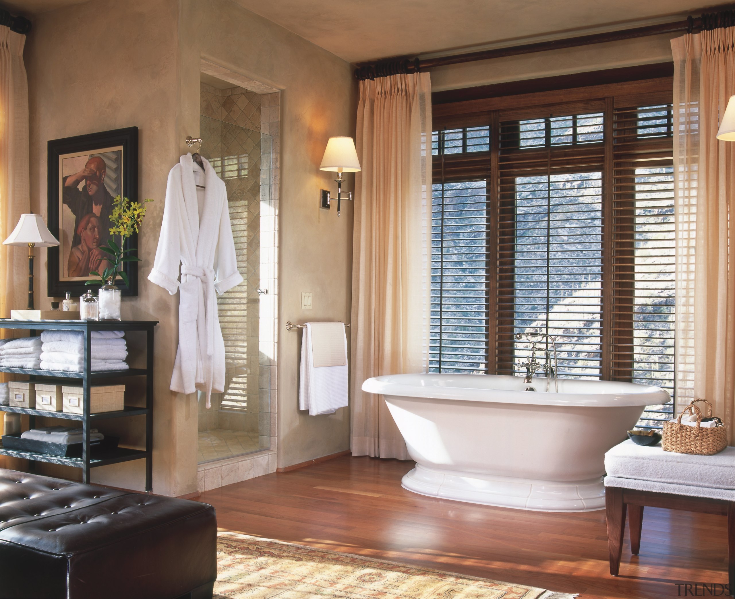 A view of the master bathroom featuring freestanding bathroom, estate, floor, flooring, home, interior design, plumbing fixture, room, window, window treatment, brown