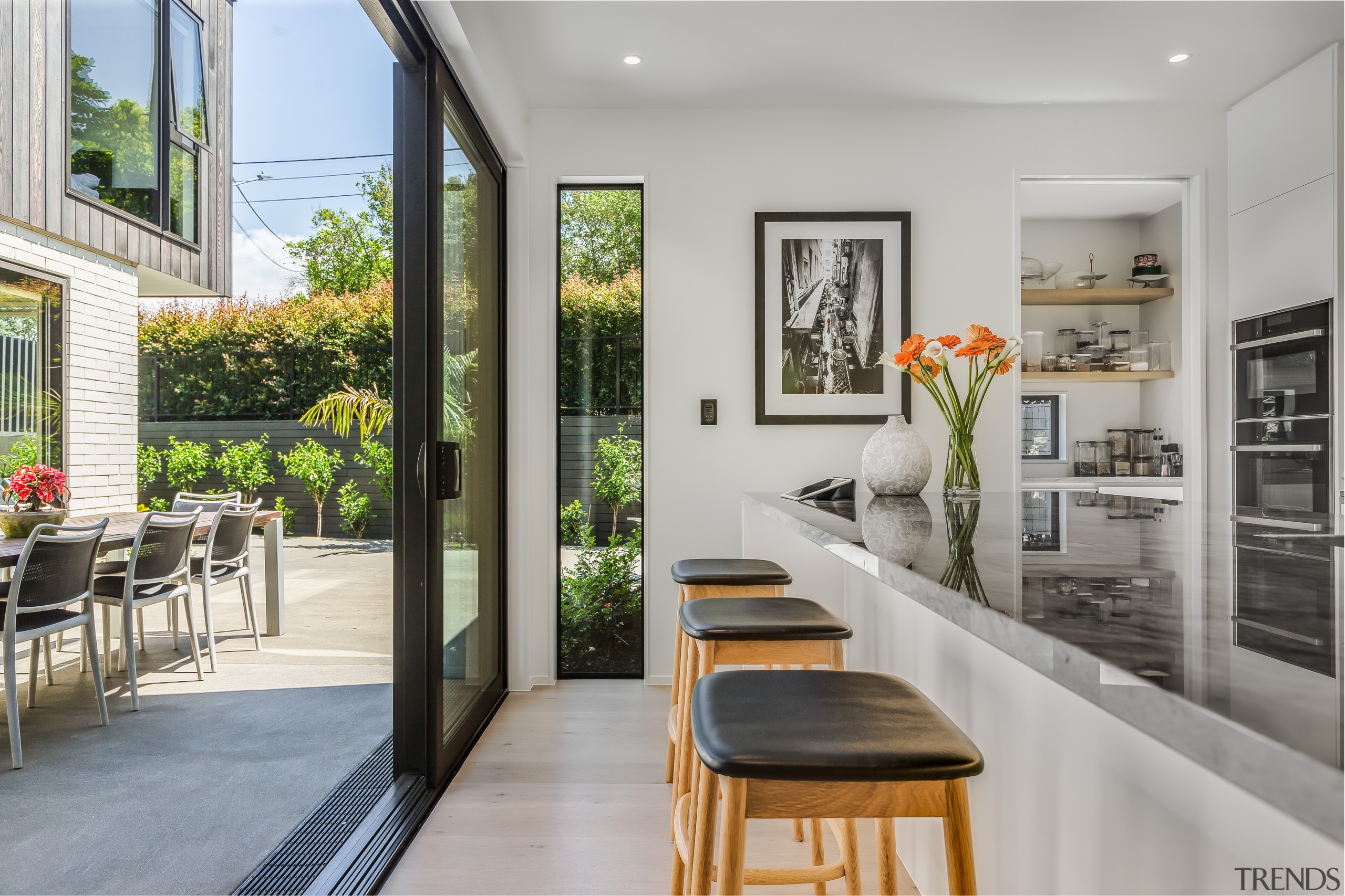 The kitchen opens up to the home's central 