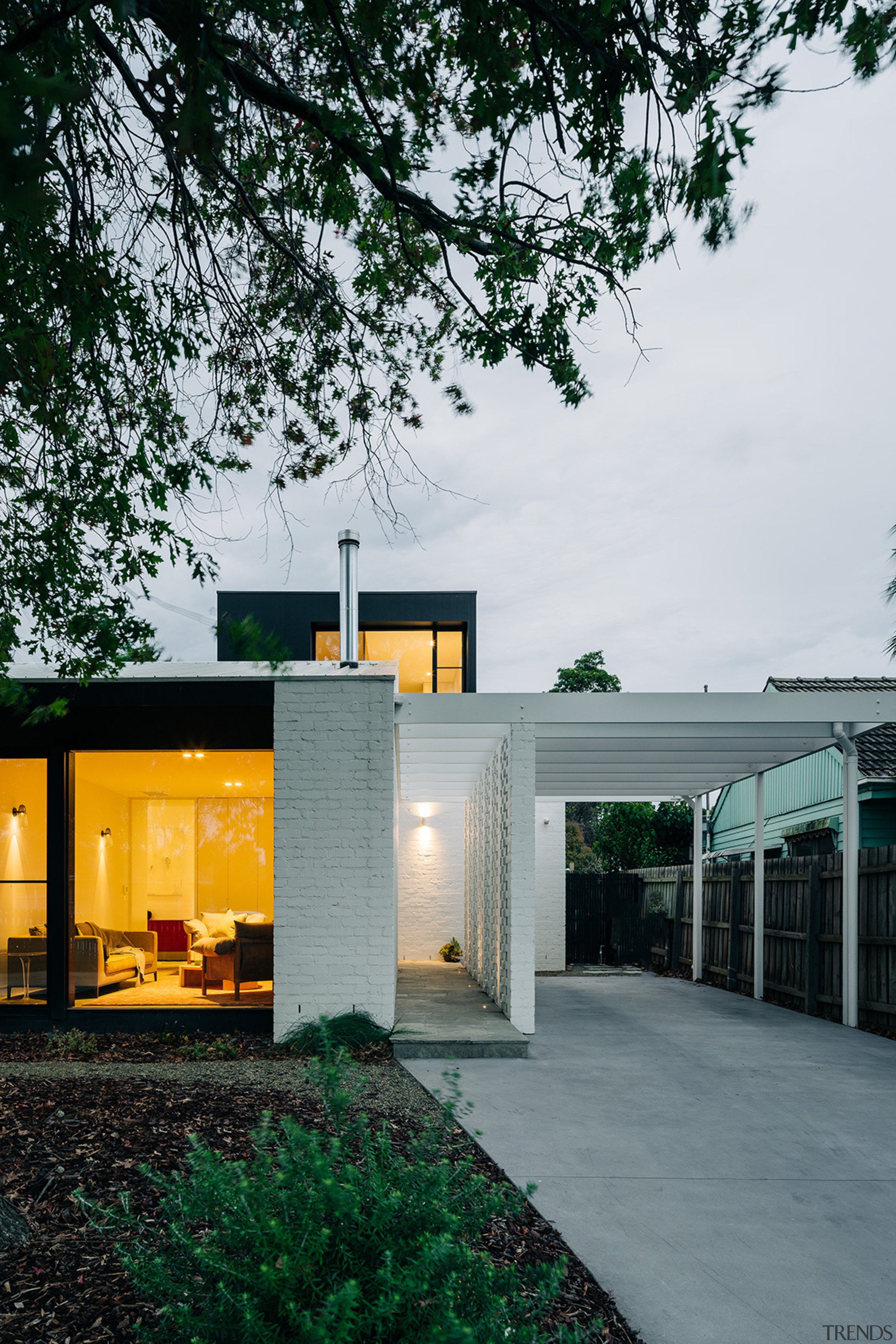 The front of the home at dusk. - 