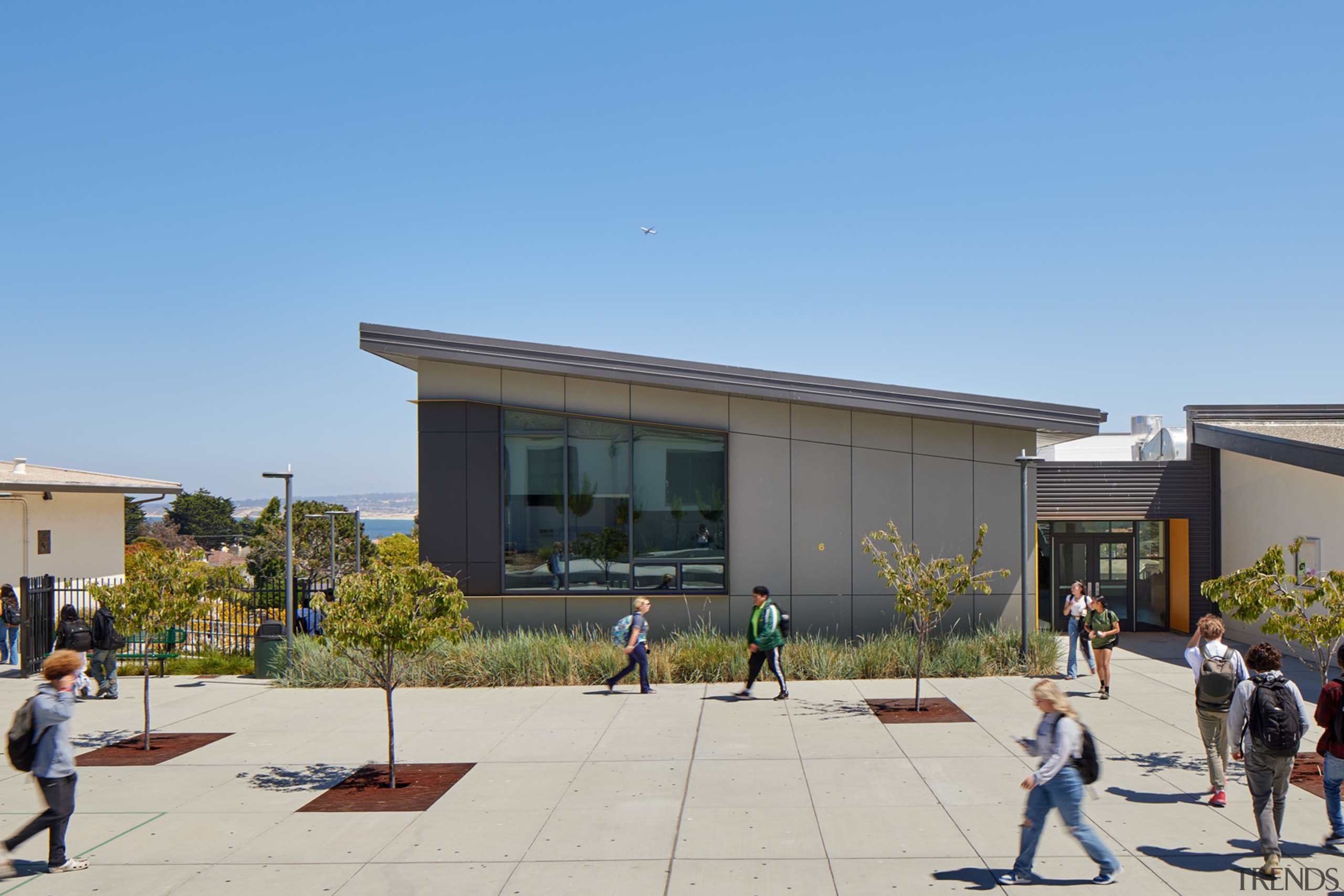 The first floor seamlessly opens to outdoor plazas 