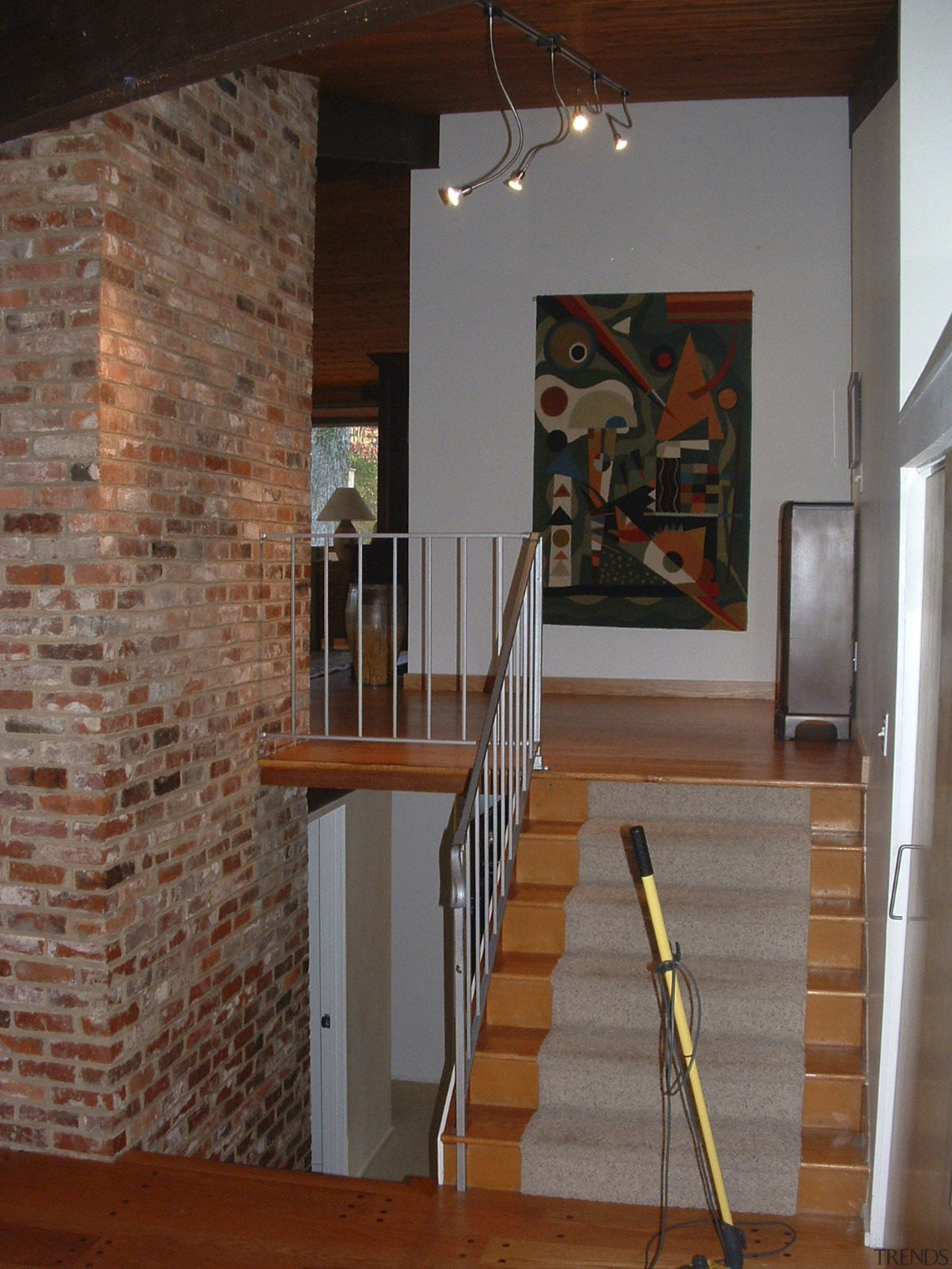 Before-and-after images tell the story behind the transformation ceiling, floor, flooring, handrail, hardwood, home, house, interior design, loft, stairs, wall, wood, brown, gray