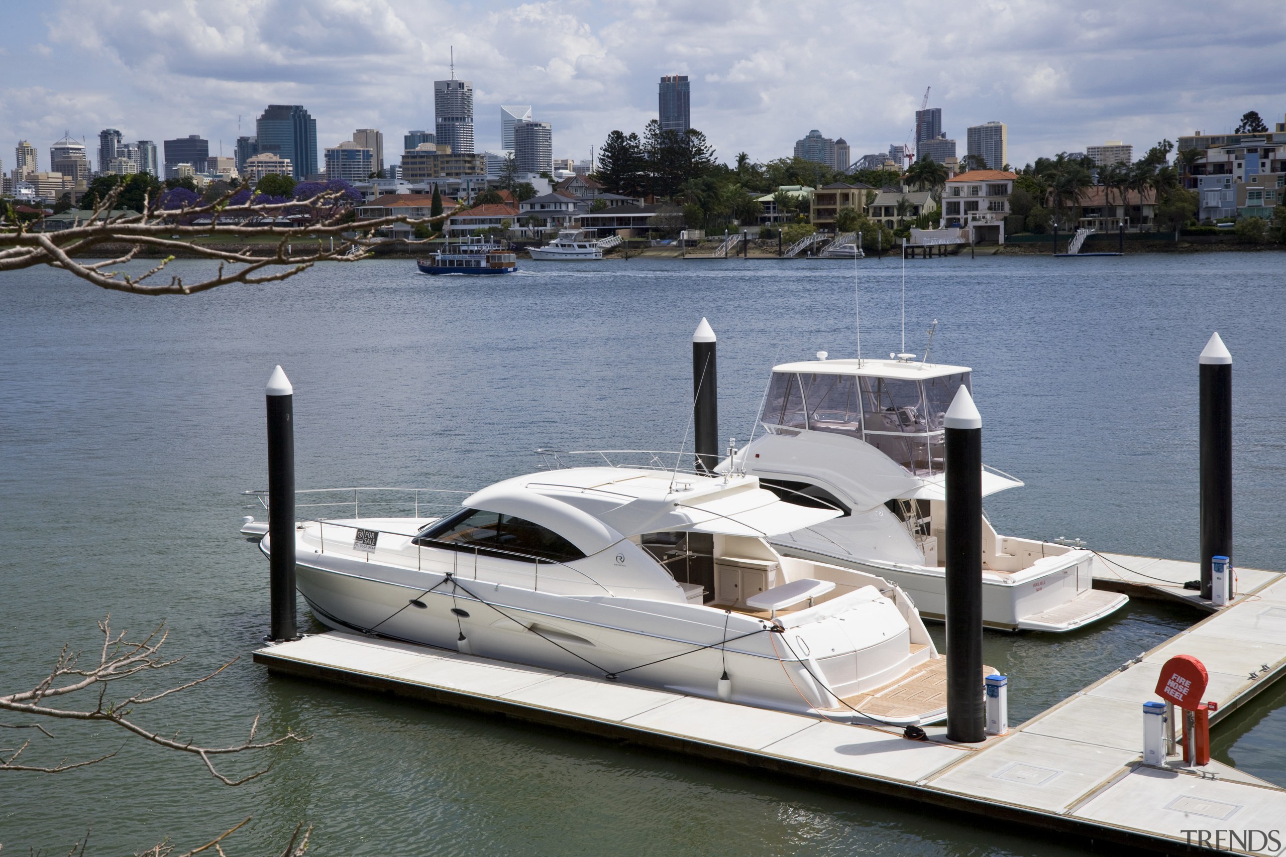 View of the Norman Reach development which is boat, boating, dock, luxury yacht, marina, motorboat, passenger ship, water, water transportation, watercraft, yacht, gray