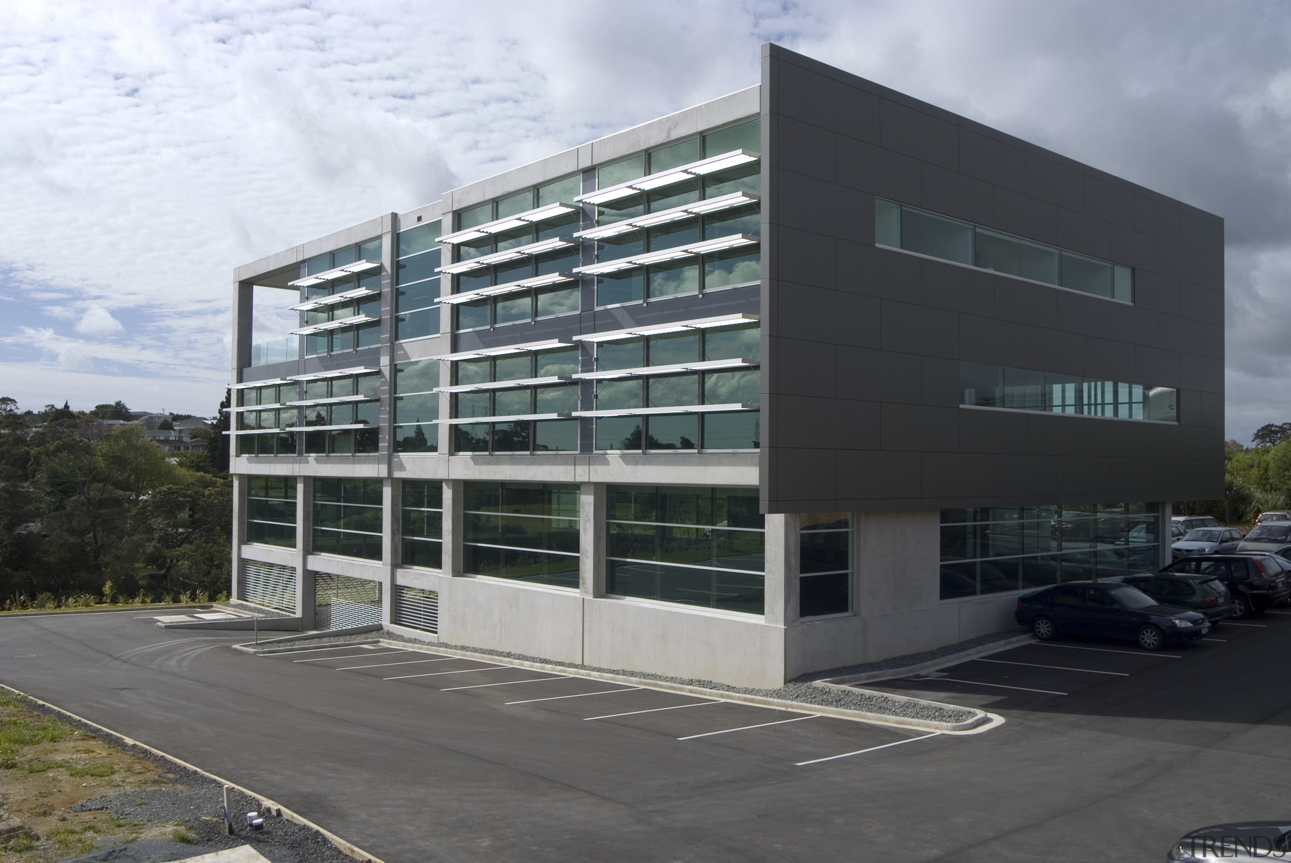 This sustainable office building in Auckland, the head architecture, building, commercial building, condominium, corporate headquarters, facade, headquarters, metropolitan area, mixed use, real estate, residential area, black, gray, white