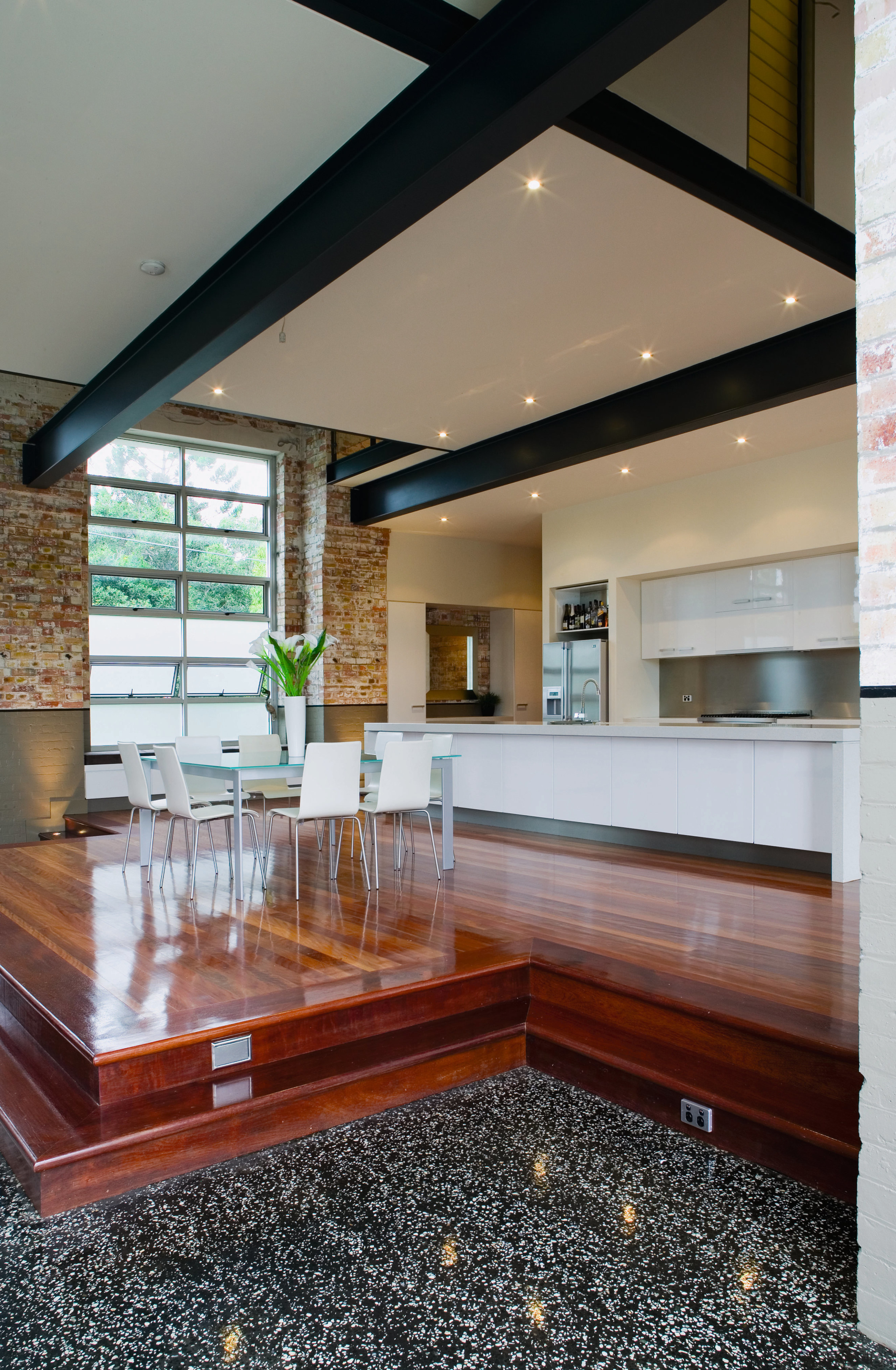 A view of the kitchen and dining areas, architecture, ceiling, countertop, daylighting, floor, home, house, interior design, living room, real estate, gray