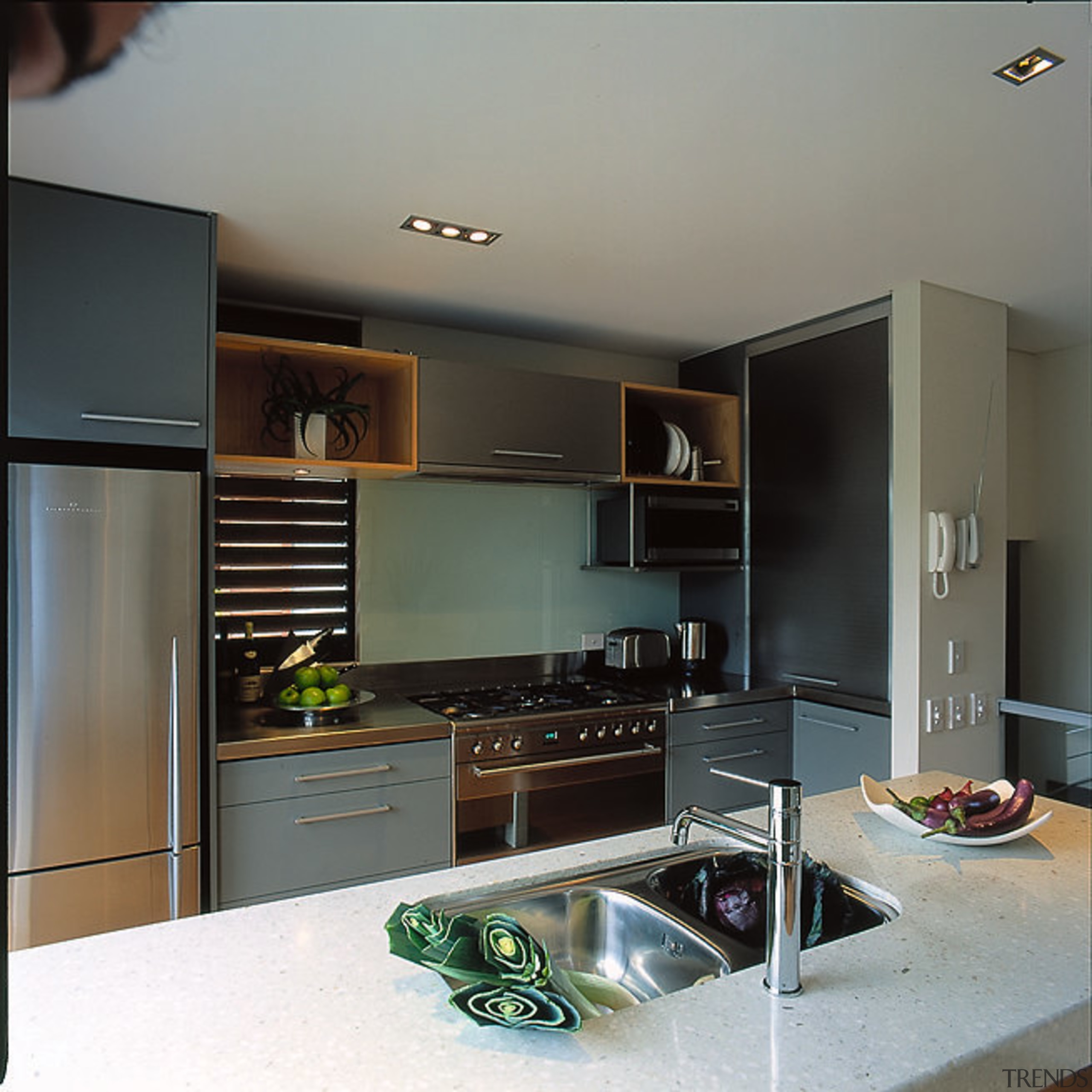 View of kitchen from the island looking towards cabinetry, countertop, home appliance, interior design, kitchen, room, gray, black